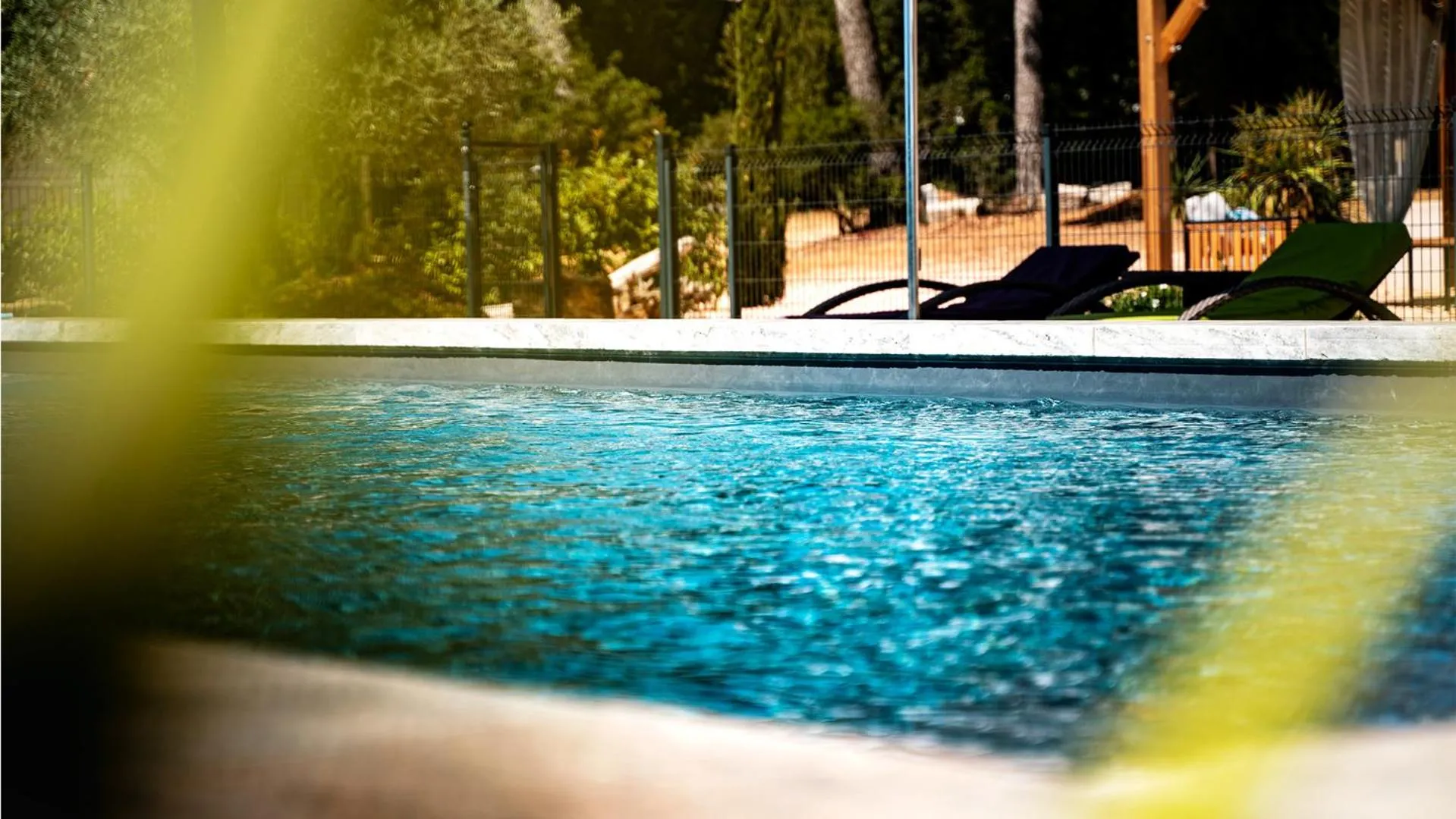 Swimming pool in Sous Les Pins gîtes et chambres d'hôtes