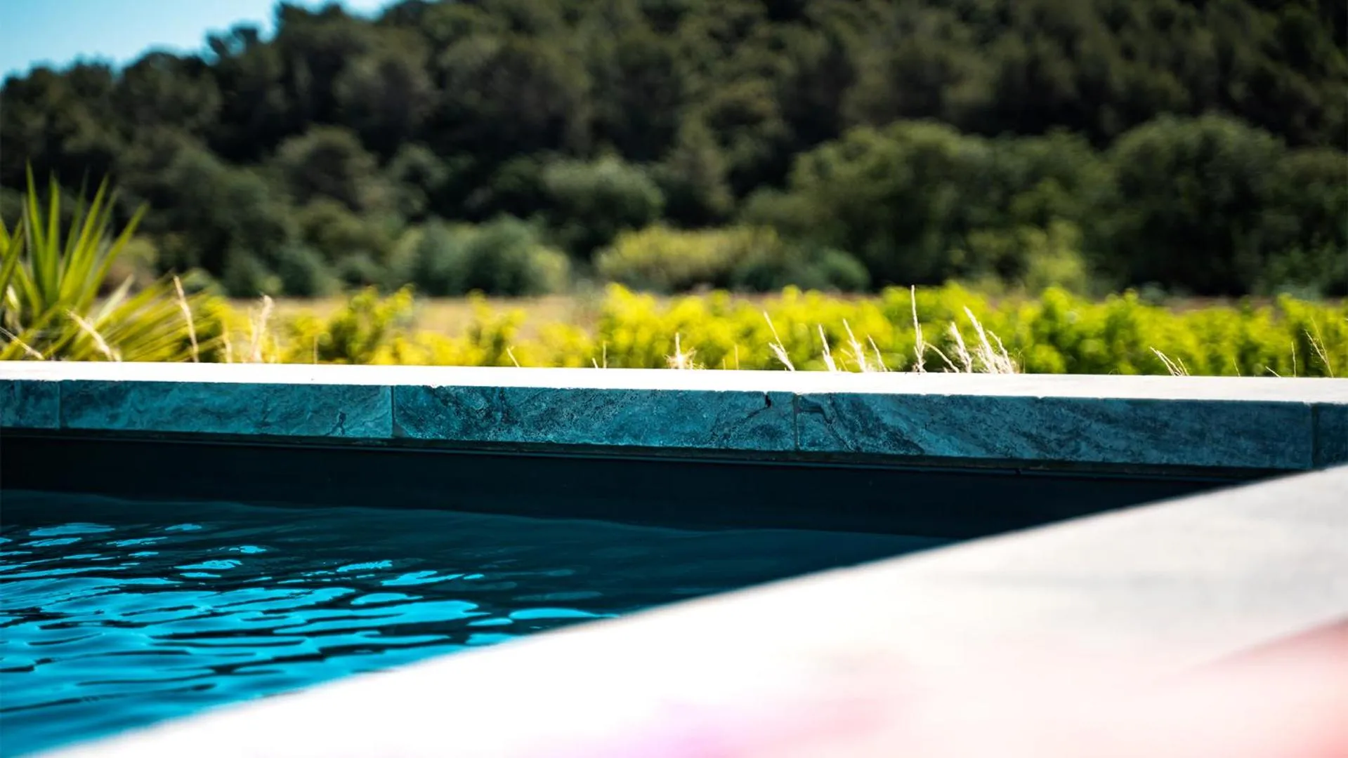 Swimming pool in Sous Les Pins gîtes et chambres d'hôtes