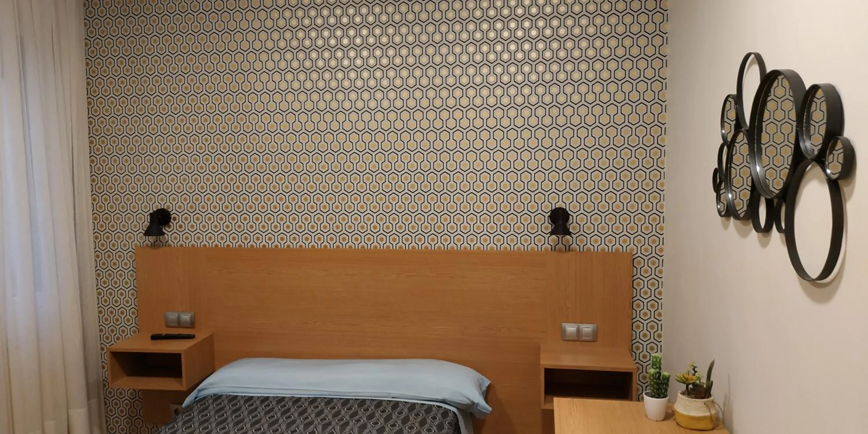 Bed in Roquefer Bilbao Central Rooms