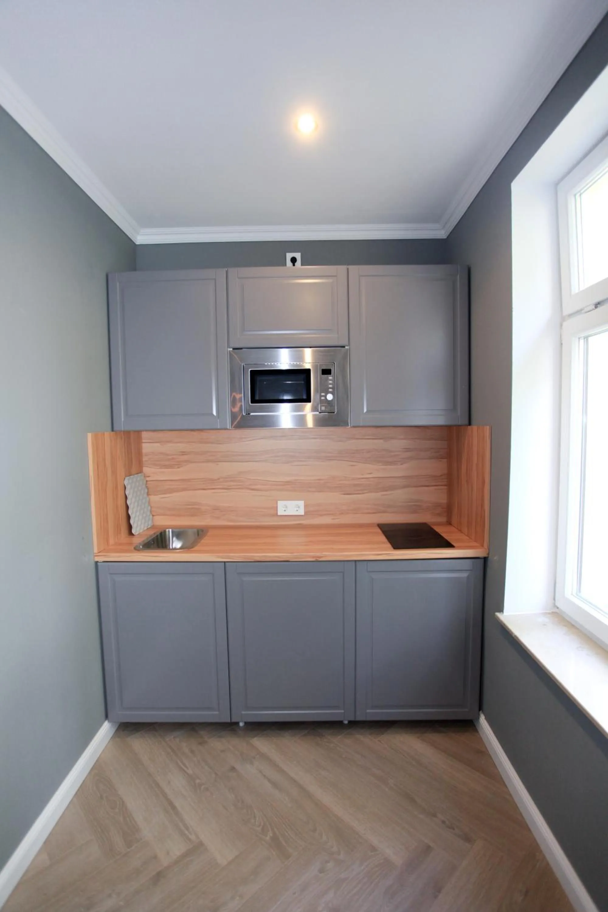 Kitchen or kitchenette in Zollikof Aparts - Sauna & Studioapartments