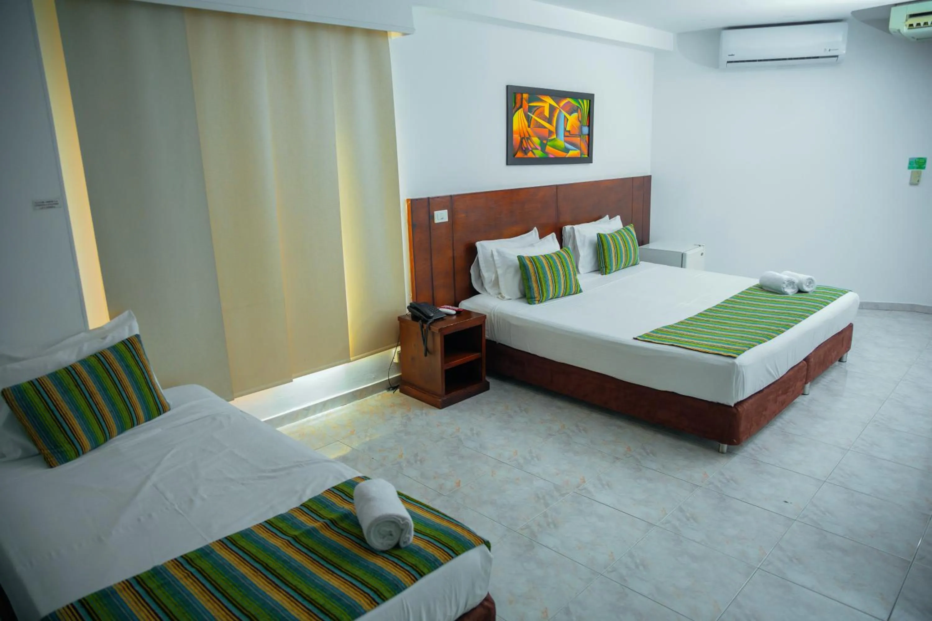 Bed in TAMA Hotel Granada Real Cali