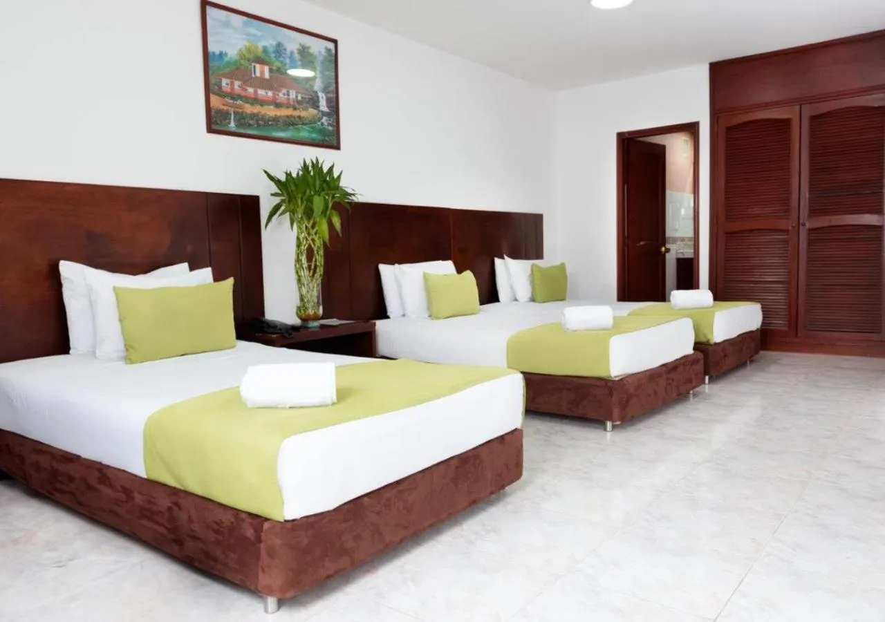 Bed in TAMA Hotel Granada Real Cali