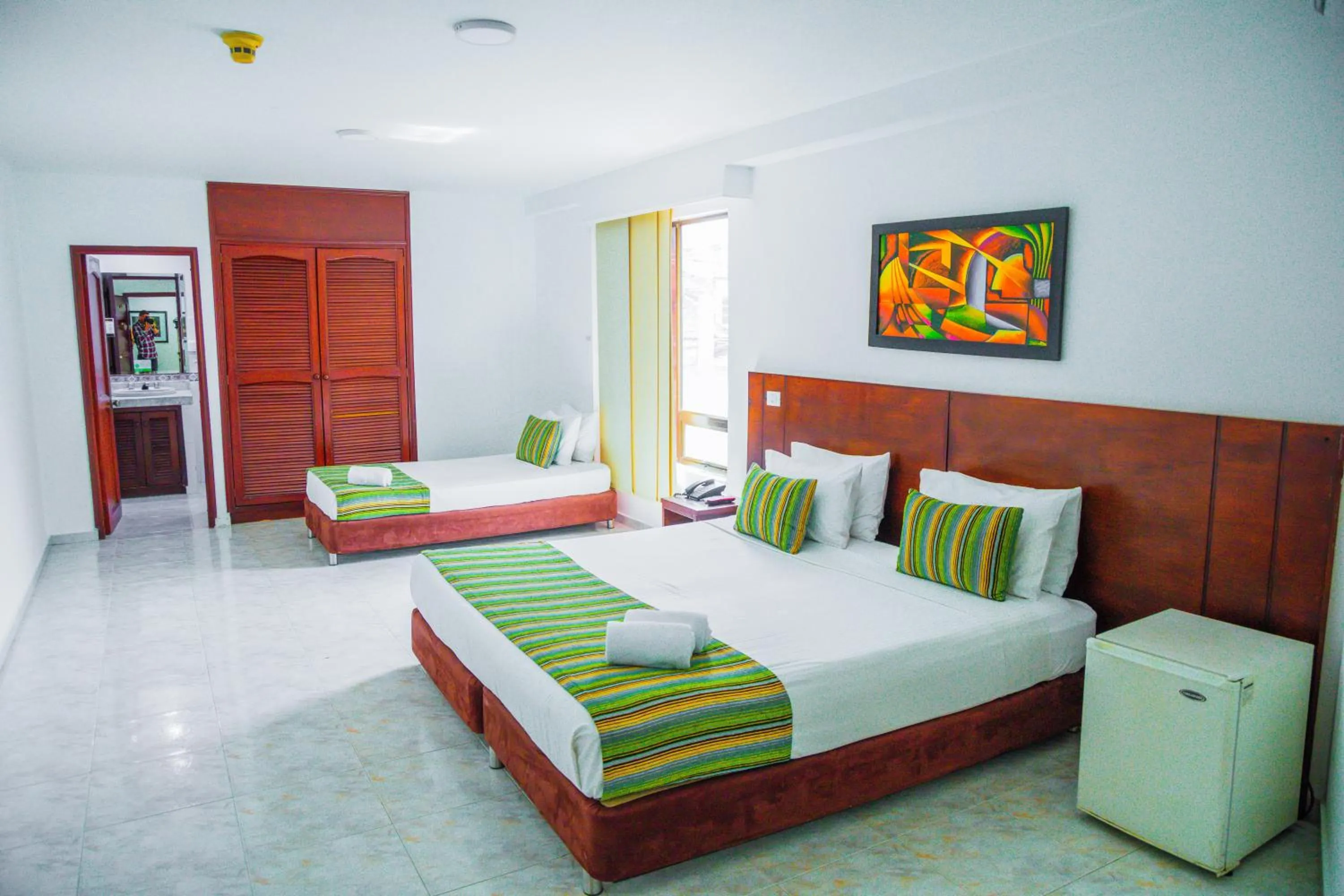 Bed in TAMA Hotel Granada Real Cali