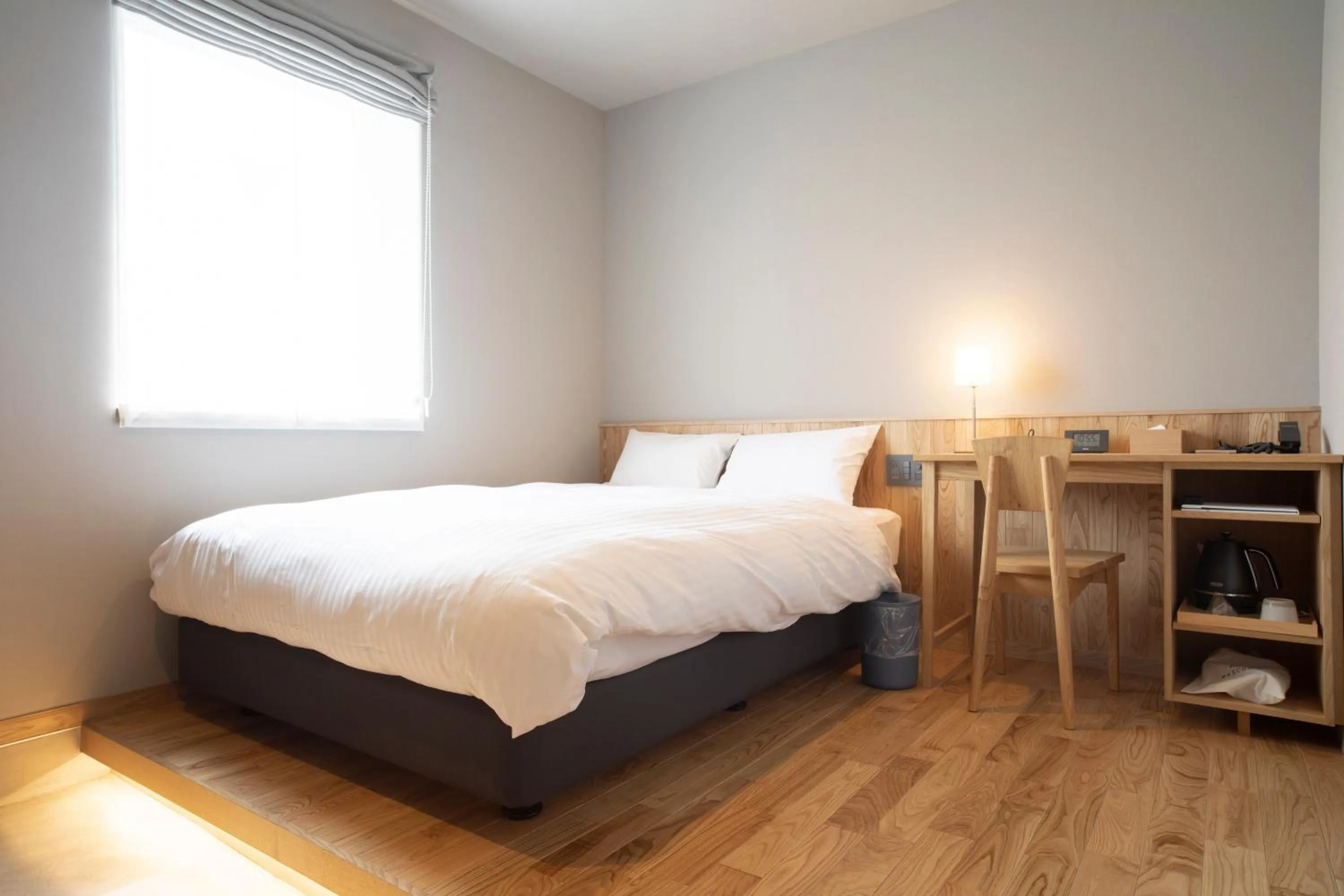 Bed in MASCOS HOTEL Masuda Onsen