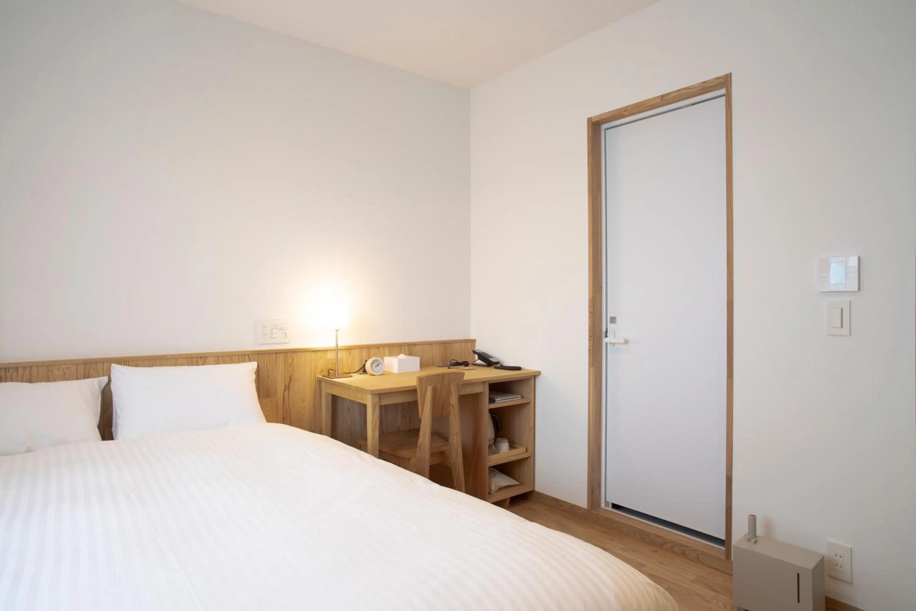 Bed in MASCOS HOTEL Masuda Onsen