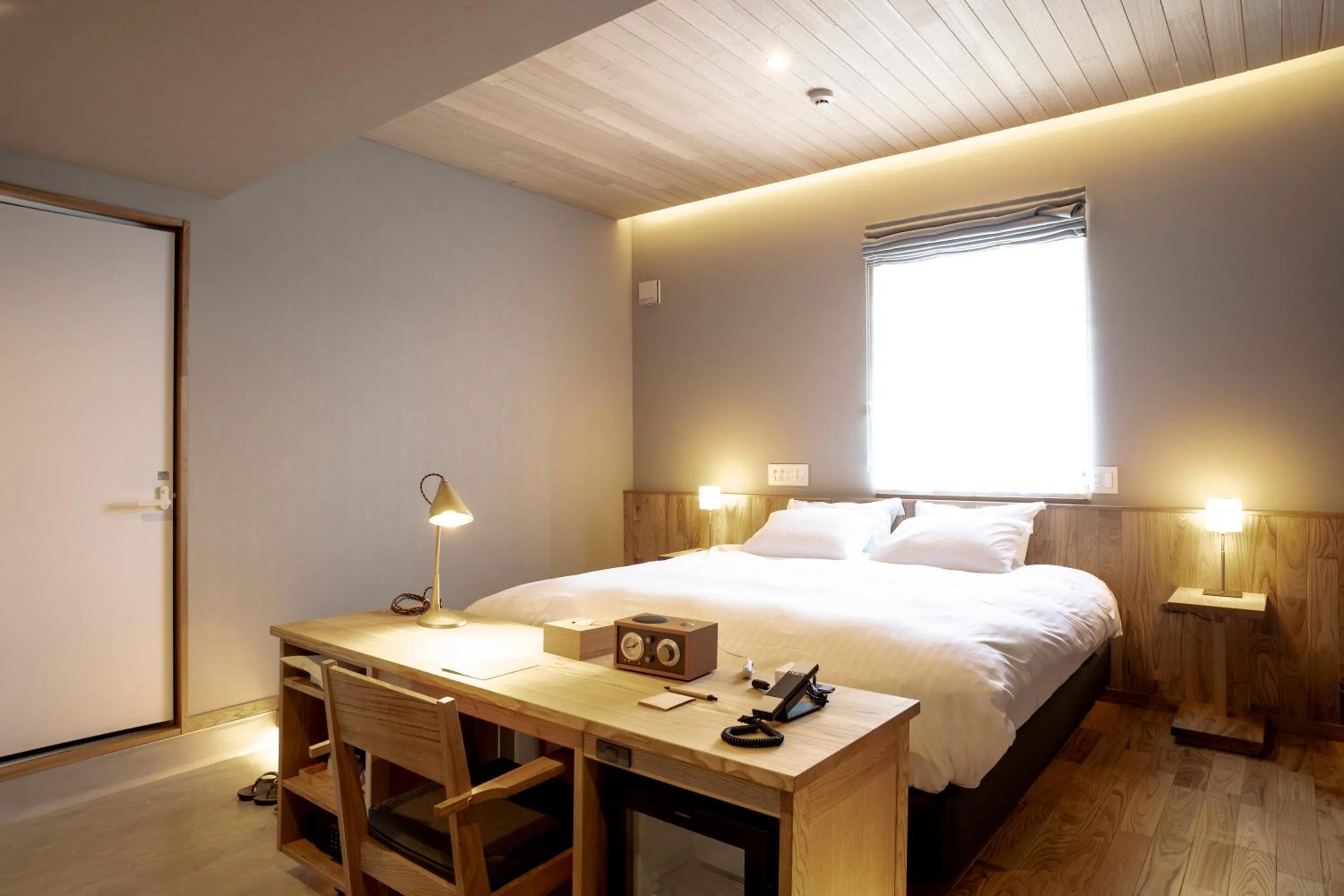 Bed in MASCOS HOTEL Masuda Onsen