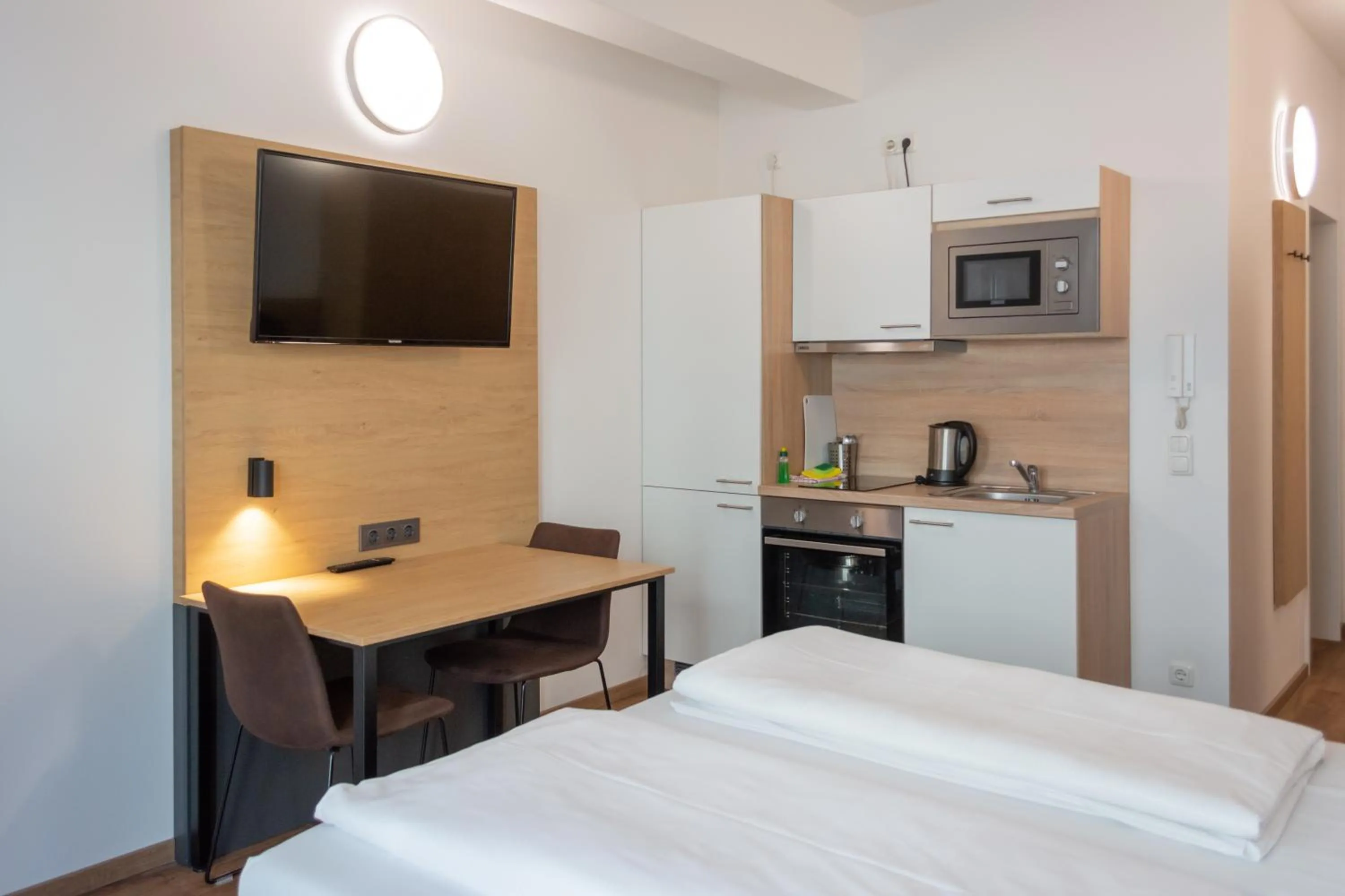 Kitchen or kitchenette, Bed in Apartimo Landshut