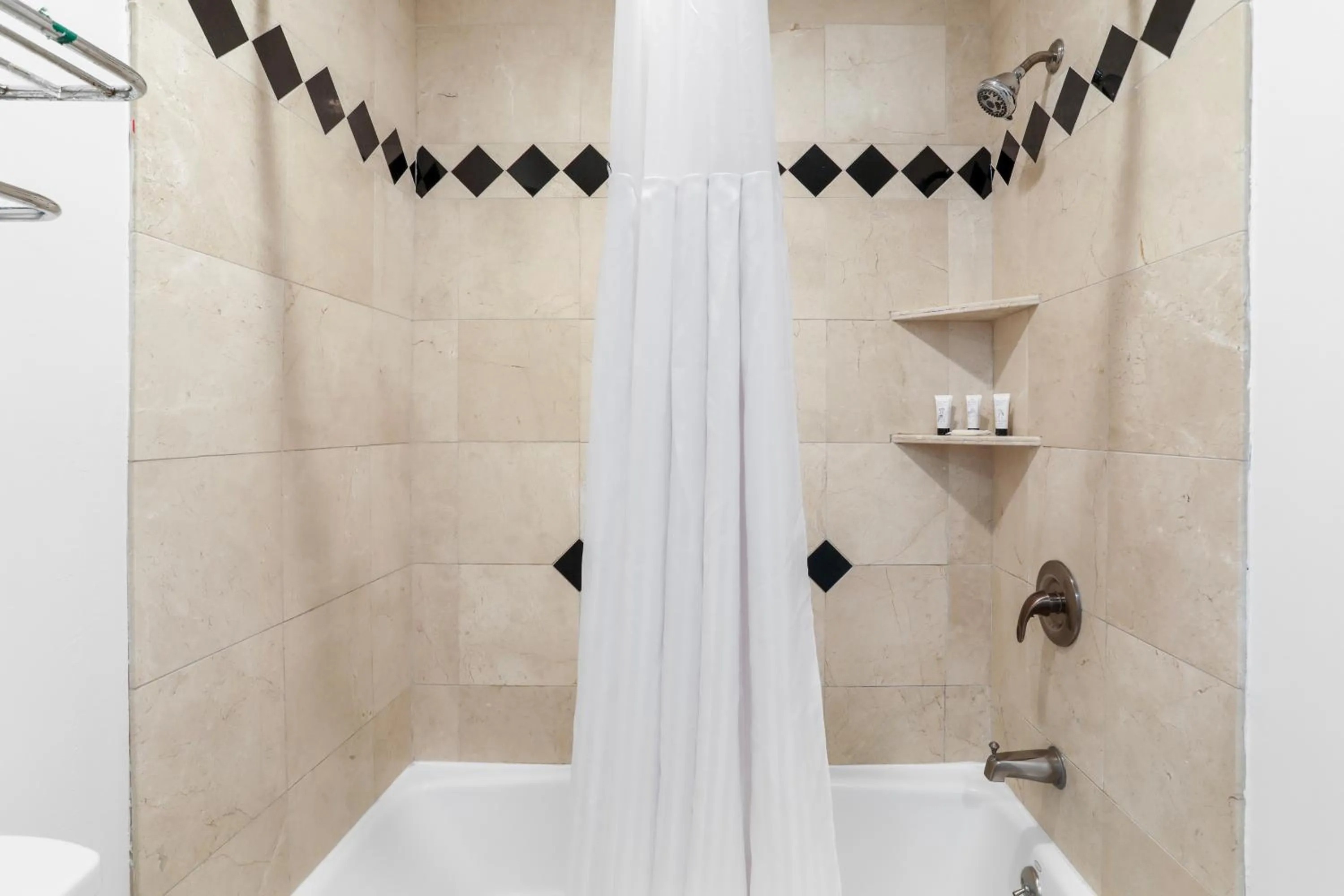 Shower in Signature Inn Berkeley