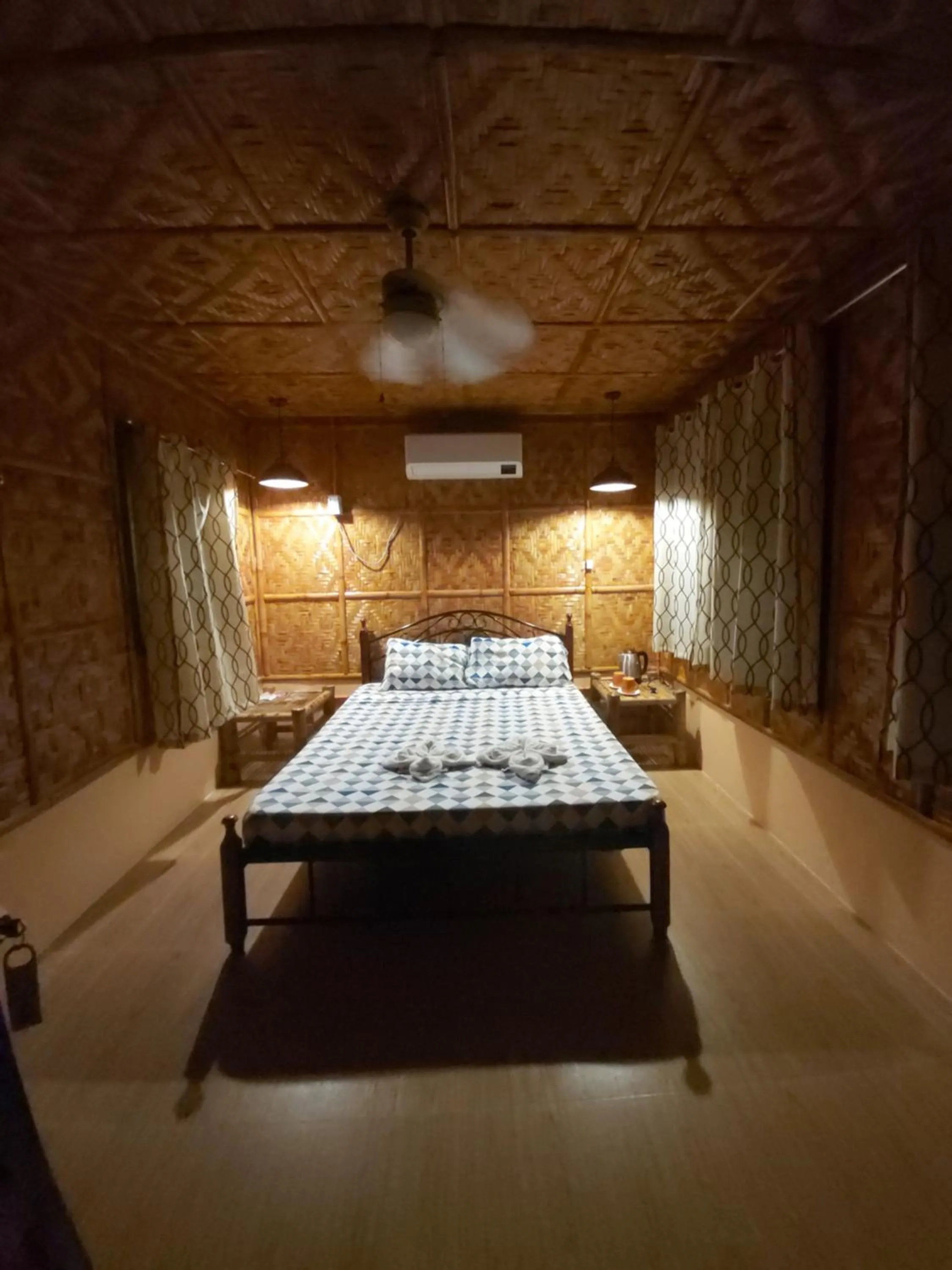 Bed in Anda Poseidon’s Beach Resort