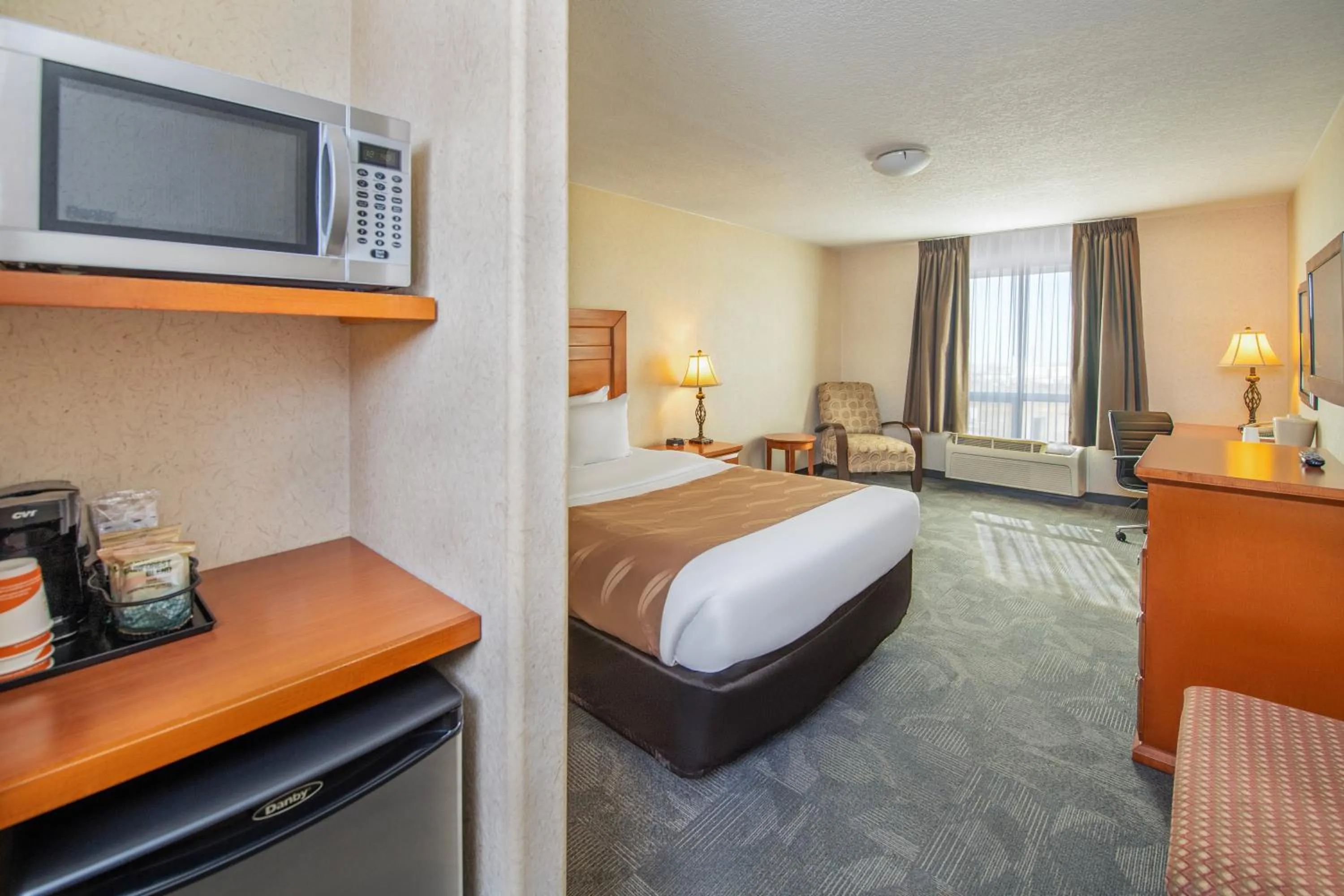 Bed in Quality Inn & Suites