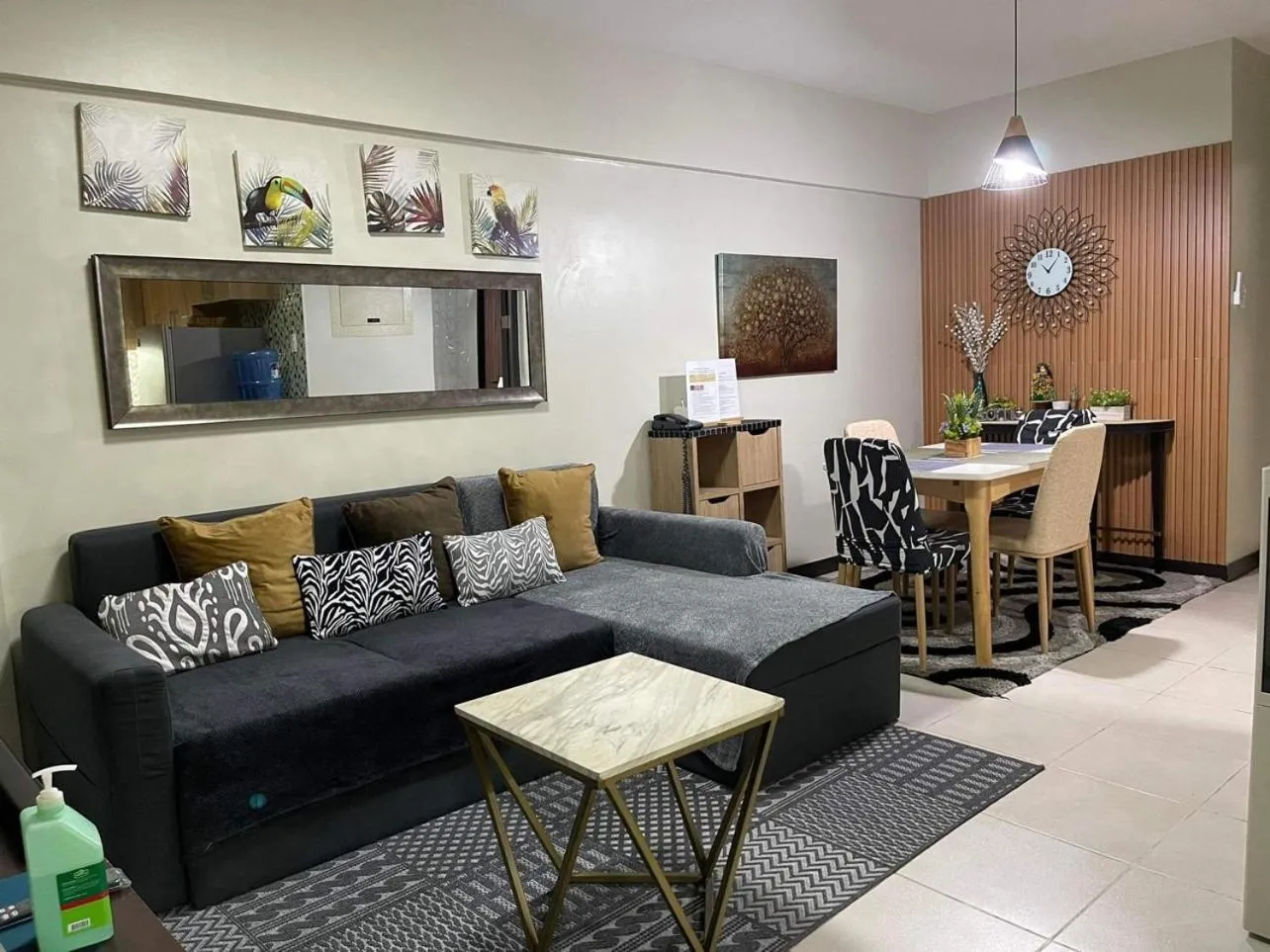 Living room in MaRoy Suites at Asteria Residences (Near NAIA with free Parking+Fiber Internet)