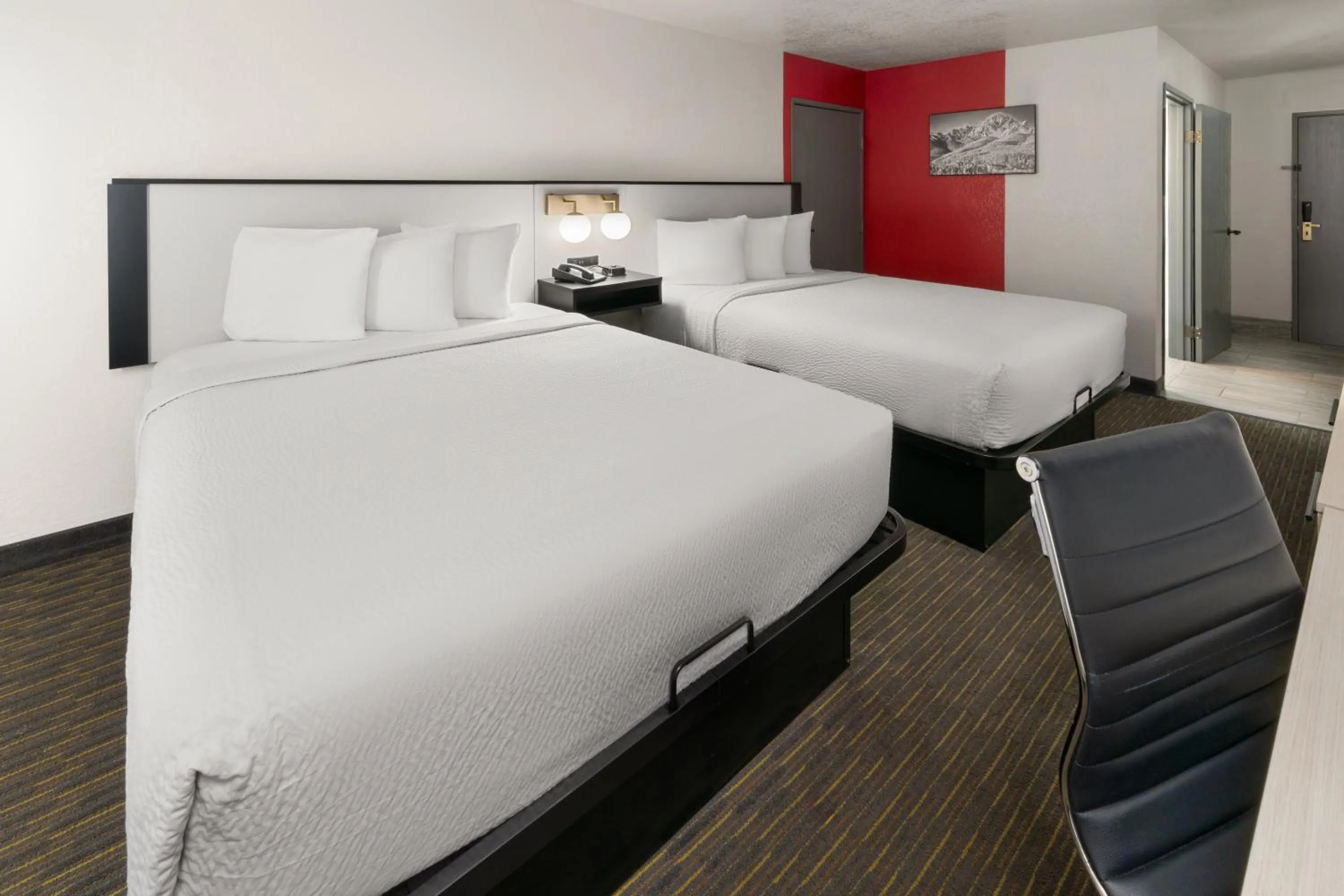 Bed in SYLO Hotel Denver Airport, a Ramada by Wyndham