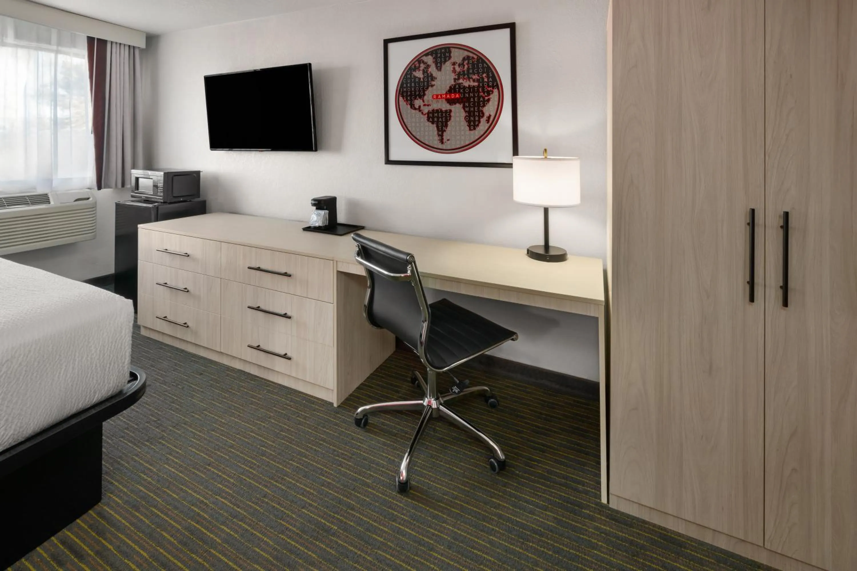 Bed in SYLO Hotel Denver Airport, a Ramada by Wyndham