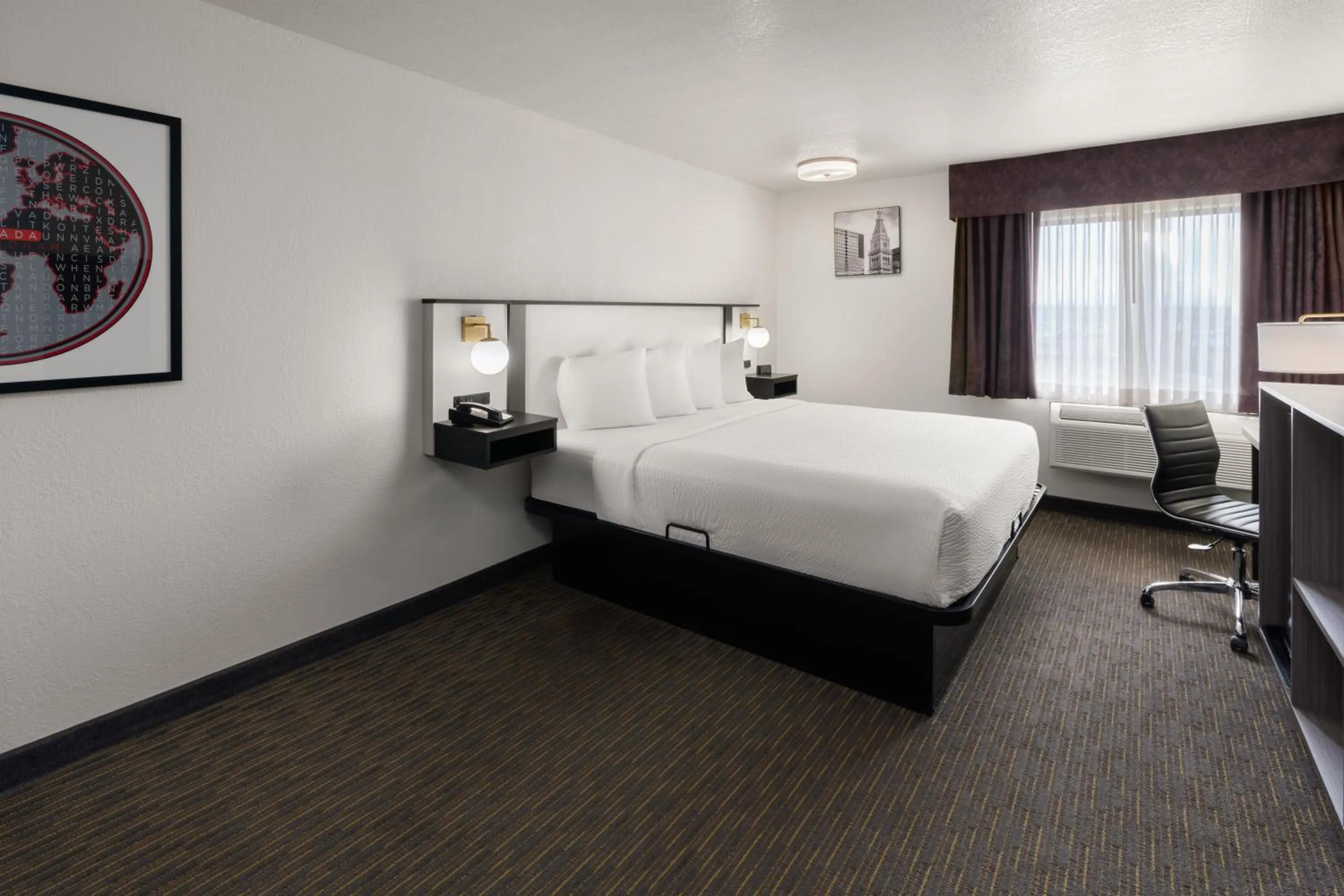 Bed in SYLO Hotel Denver Airport, a Ramada by Wyndham