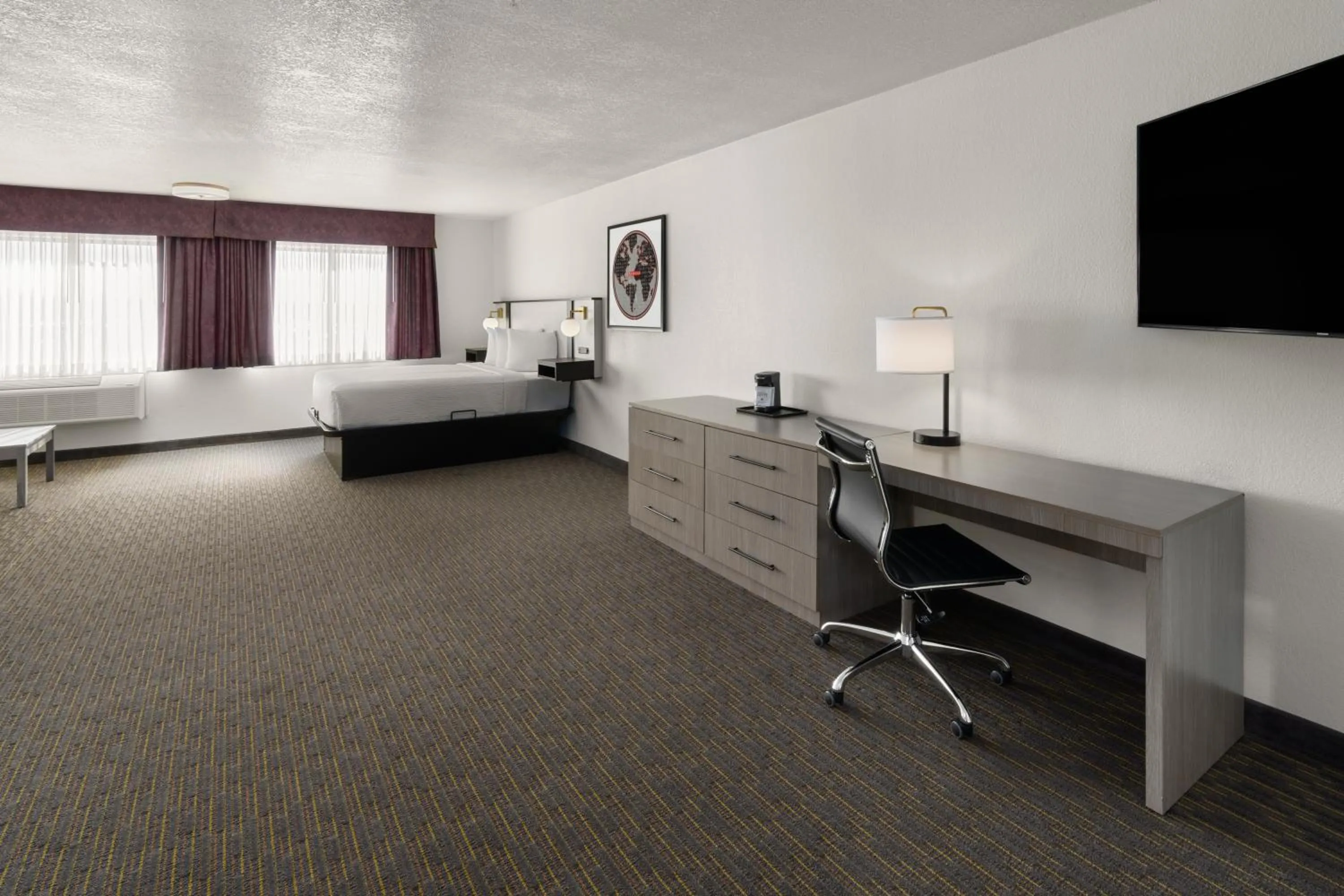 Bed in SYLO Hotel Denver Airport, a Ramada by Wyndham