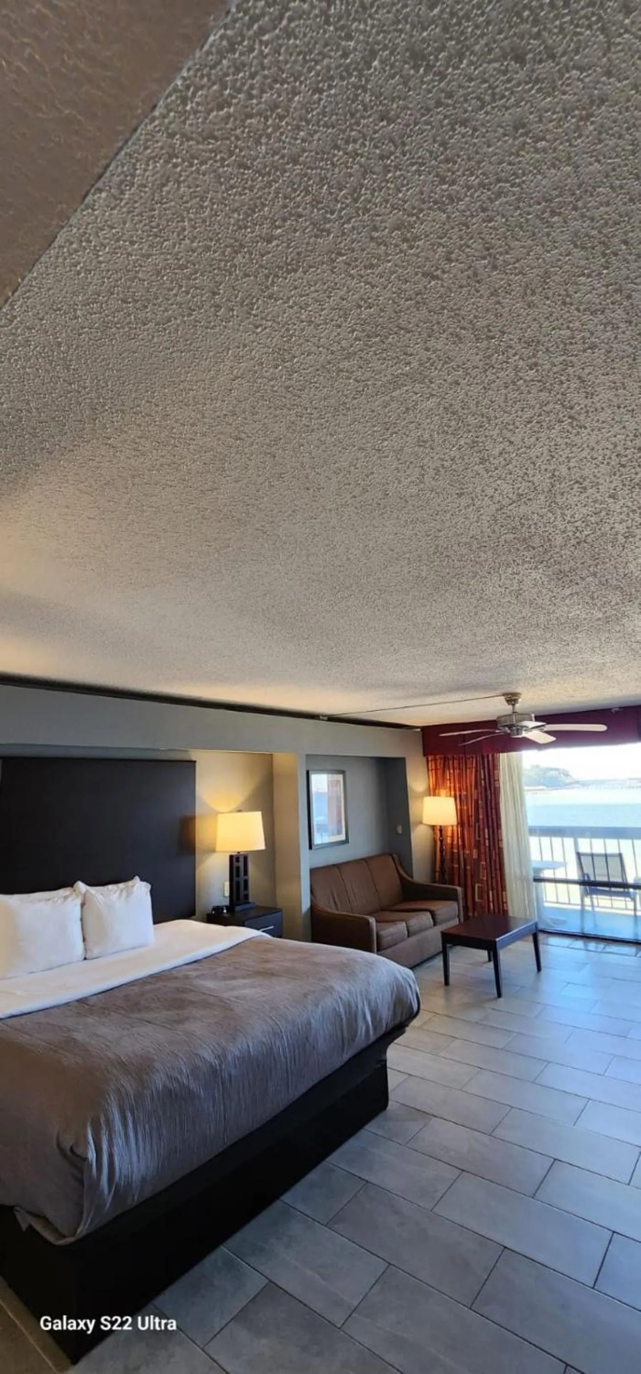 View (from property/room), Bed in Quality Inn & Suites Gulf Breeze Bayside near Pensacola Beach