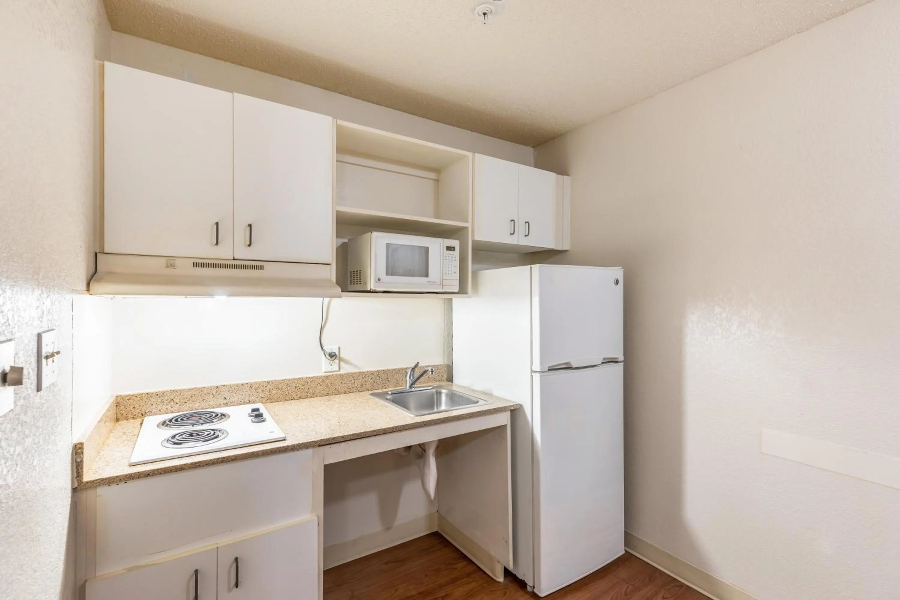 Photo of the whole room in HomeTowne Studios by Red Roof Orlando - Casselberry