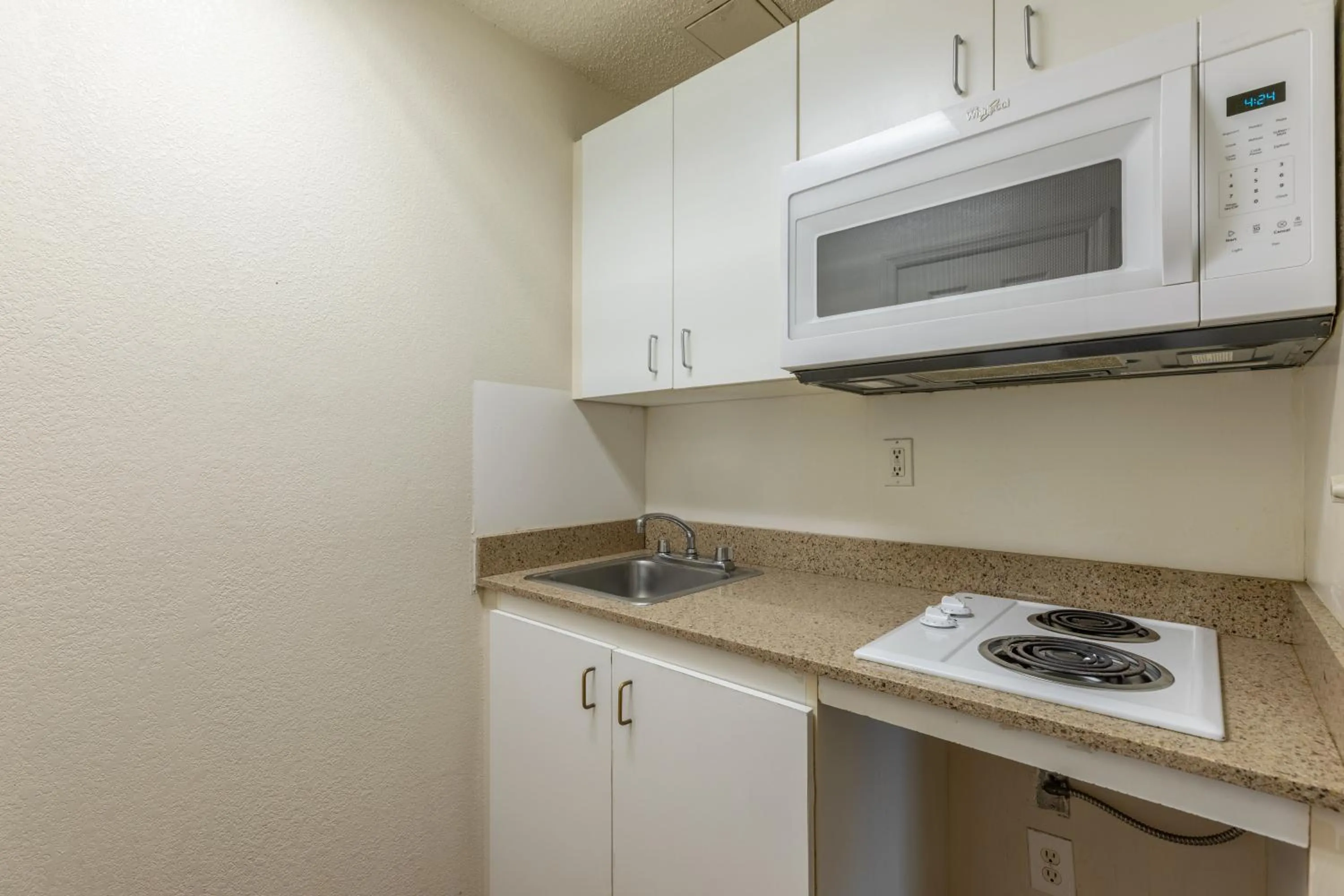 Photo of the whole room in HomeTowne Studios by Red Roof Orlando - Casselberry