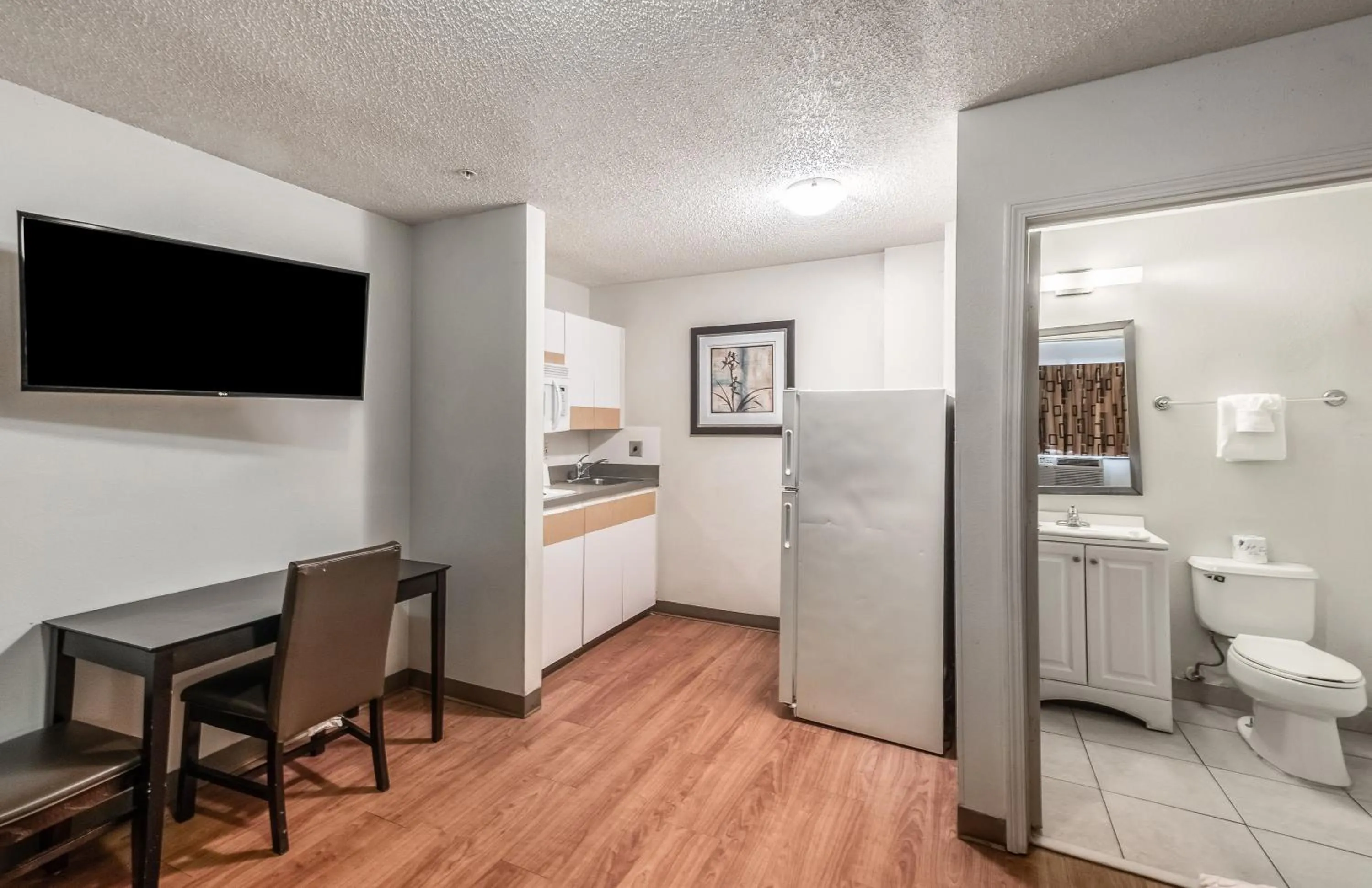 Photo of the whole room in HomeTowne Studios by Red Roof Orlando South