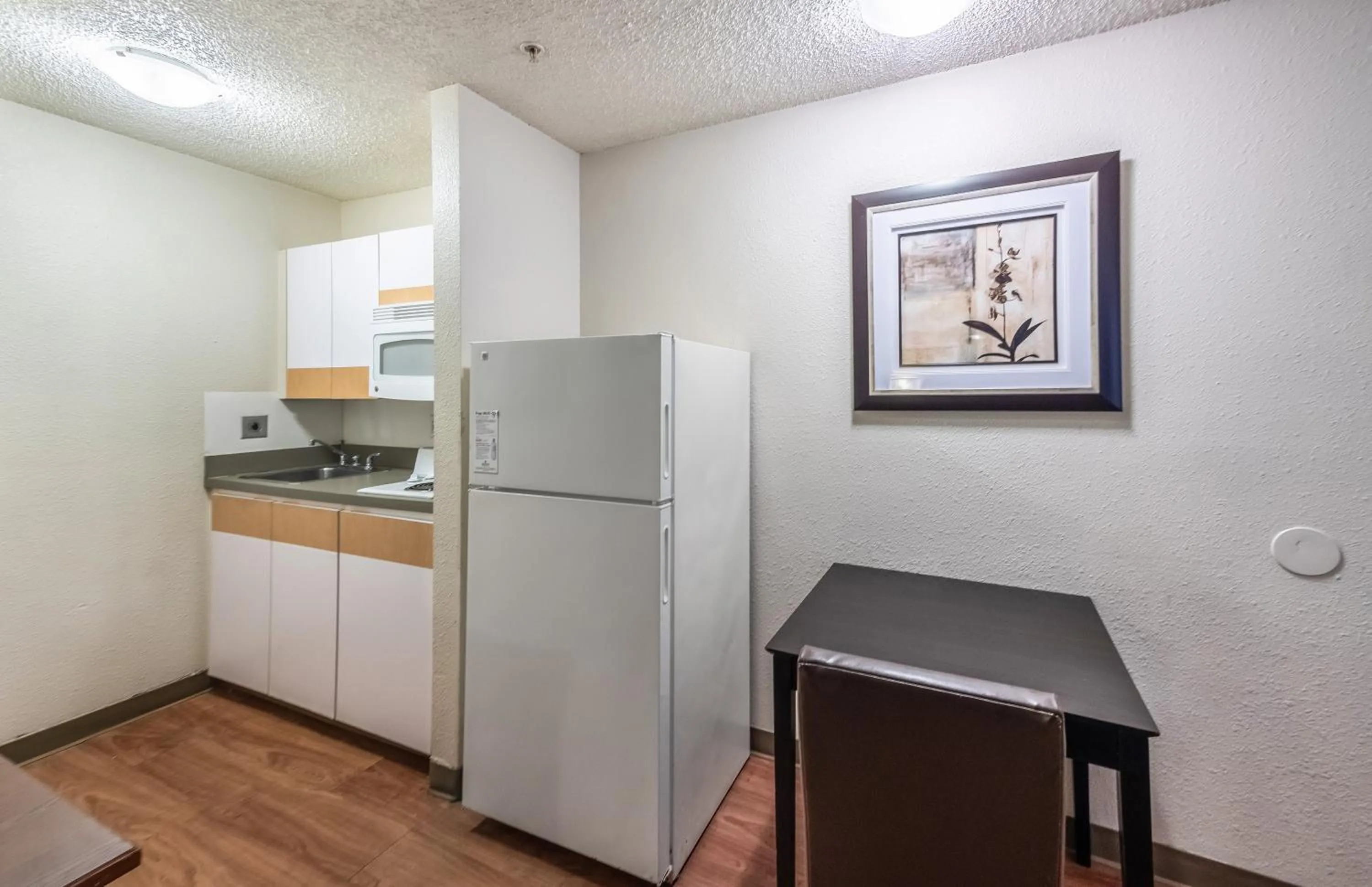 Photo of the whole room in HomeTowne Studios by Red Roof Orlando South