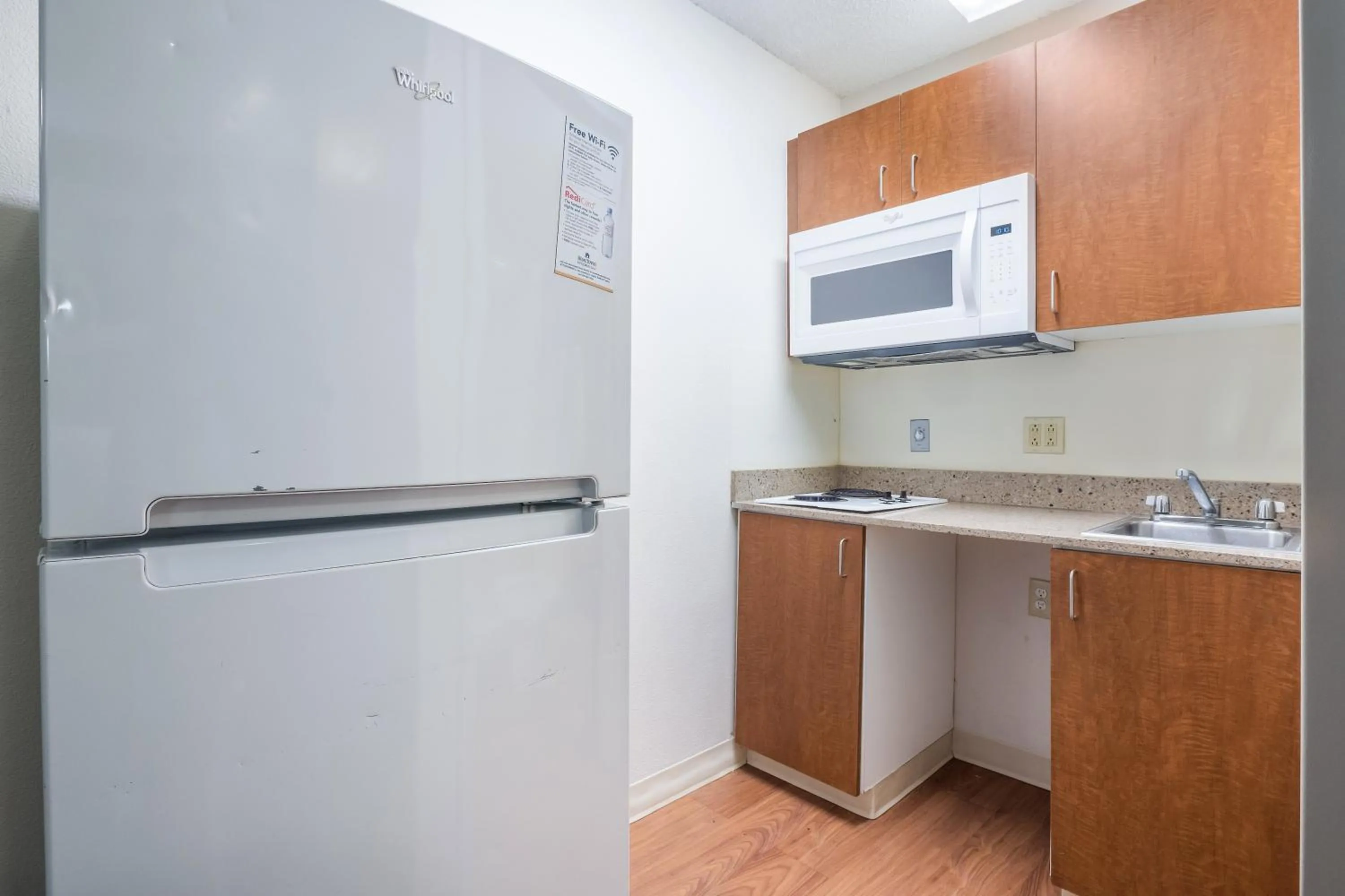 Photo of the whole room in HomeTowne Studios by Red Roof Orlando South