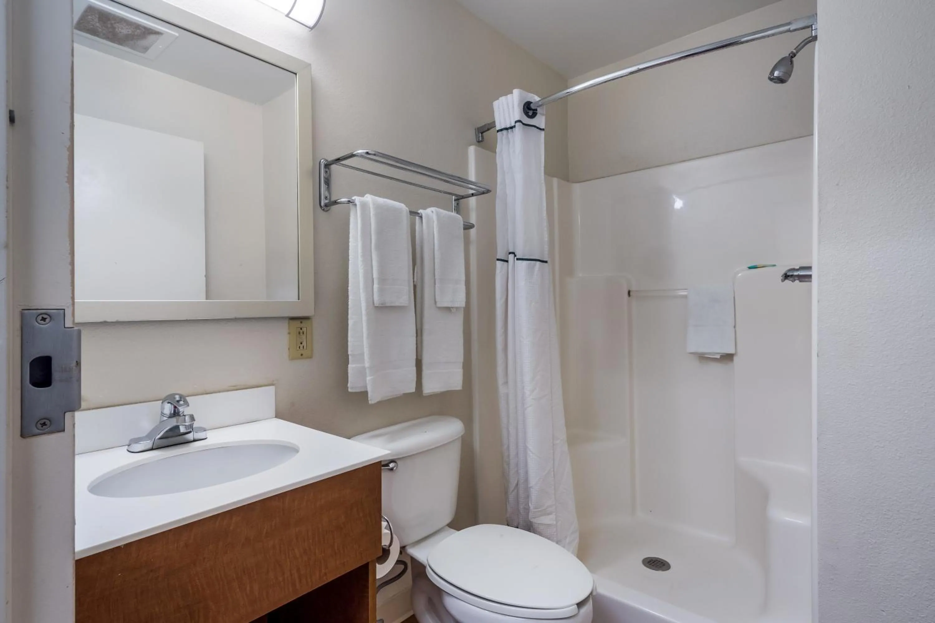 Photo of the whole room in HomeTowne Studios by Red Roof Orlando South