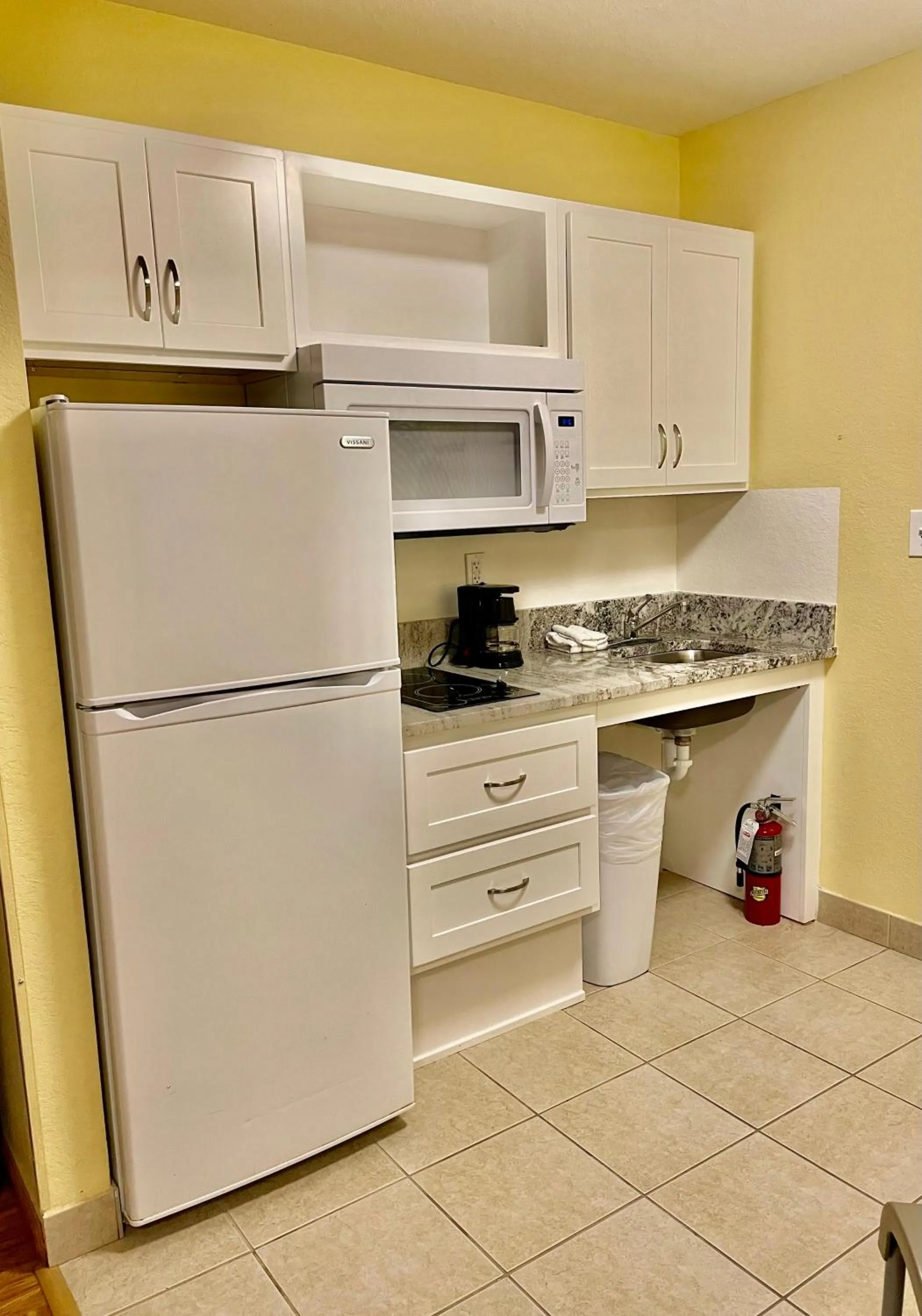 Kitchen or kitchenette in Suburban Studios Fort Myers Cape Coral