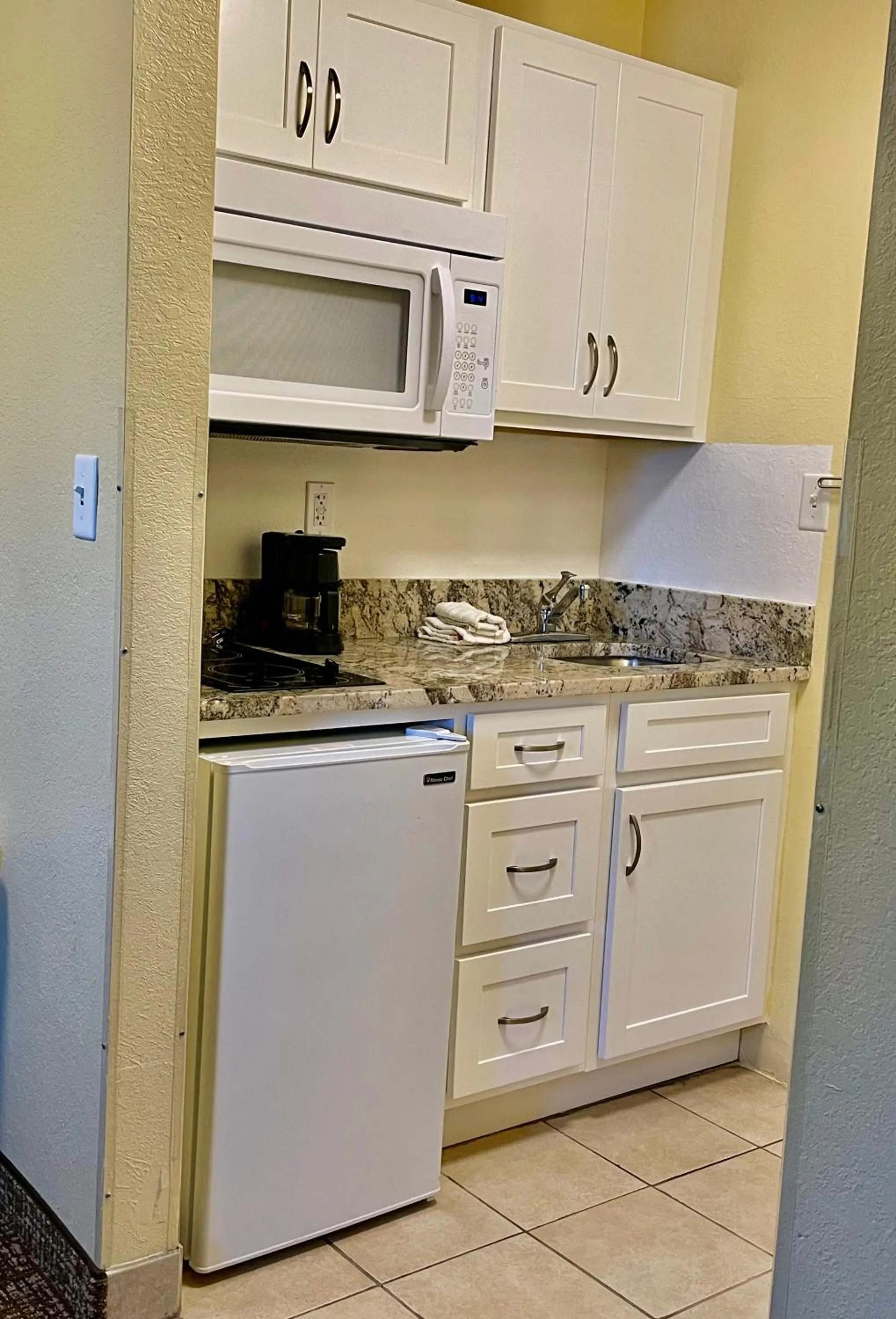 Kitchen or kitchenette in Suburban Studios Fort Myers Cape Coral