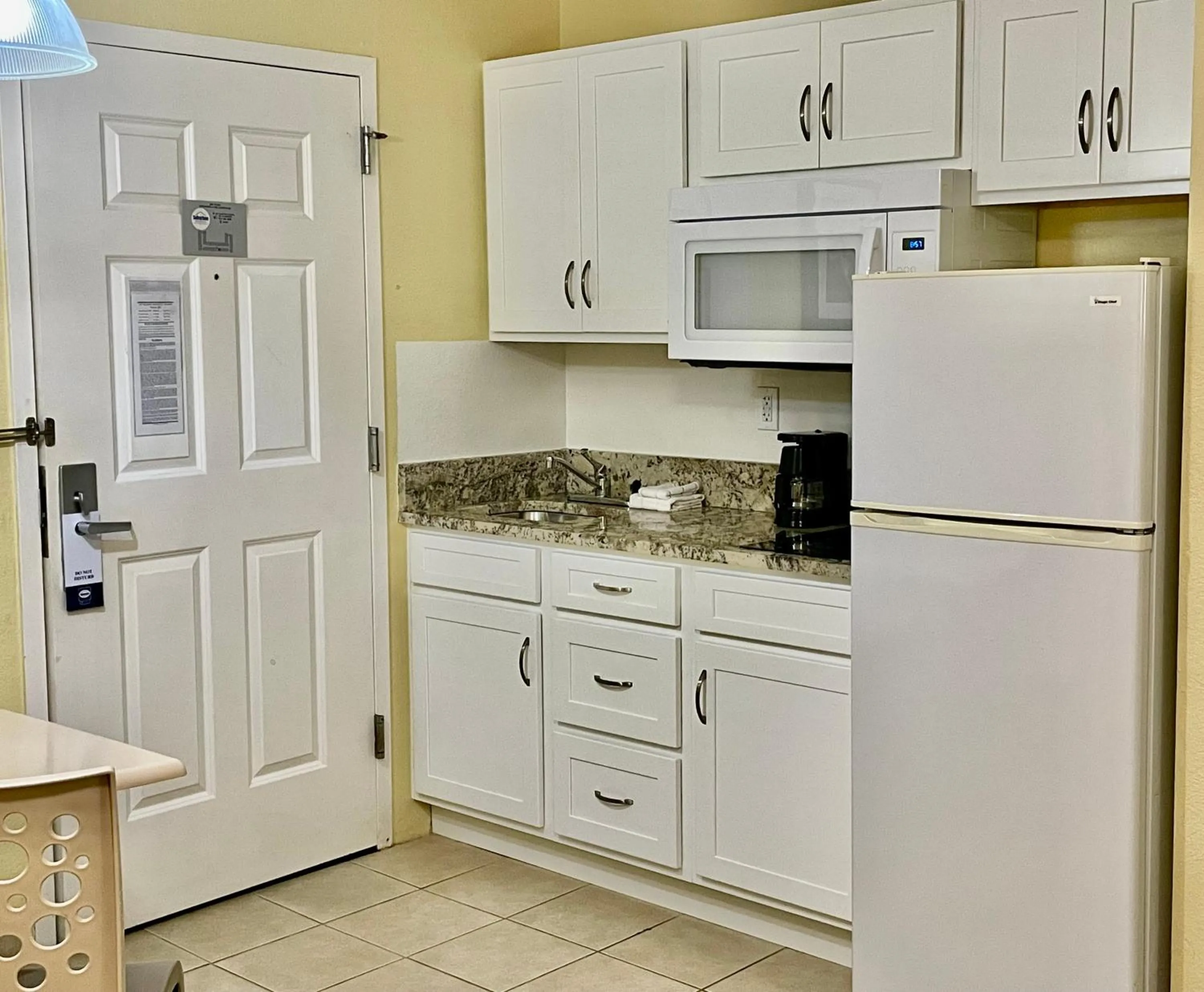 Kitchen or kitchenette in Suburban Studios Fort Myers Cape Coral
