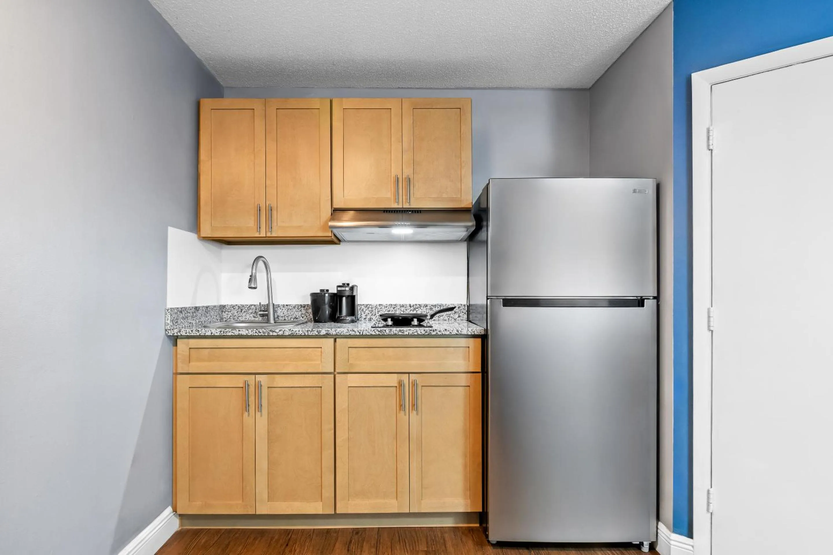 Kitchen or kitchenette in Suburban Studios Stuart near Federal Hwy 1