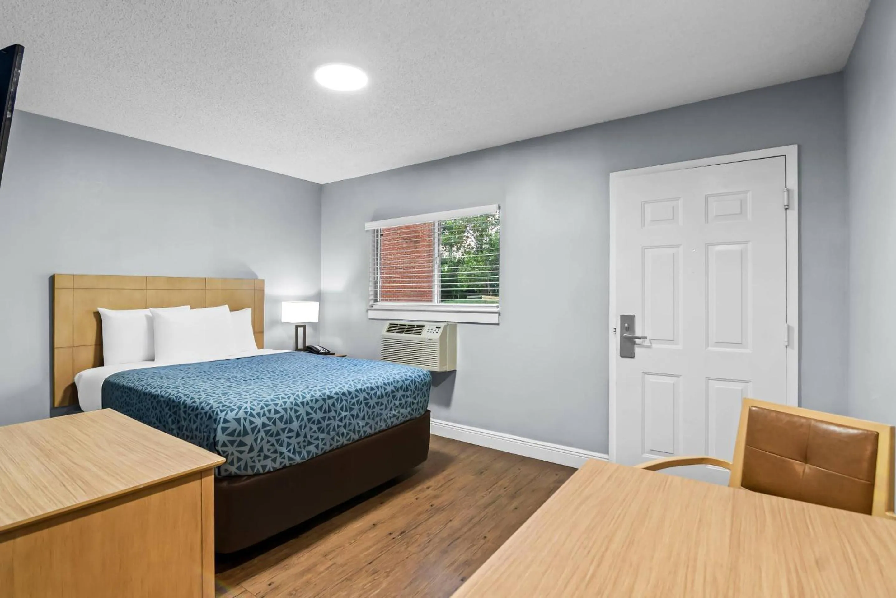 Bedroom, Bed in Suburban Studios Stuart near Federal Hwy 1