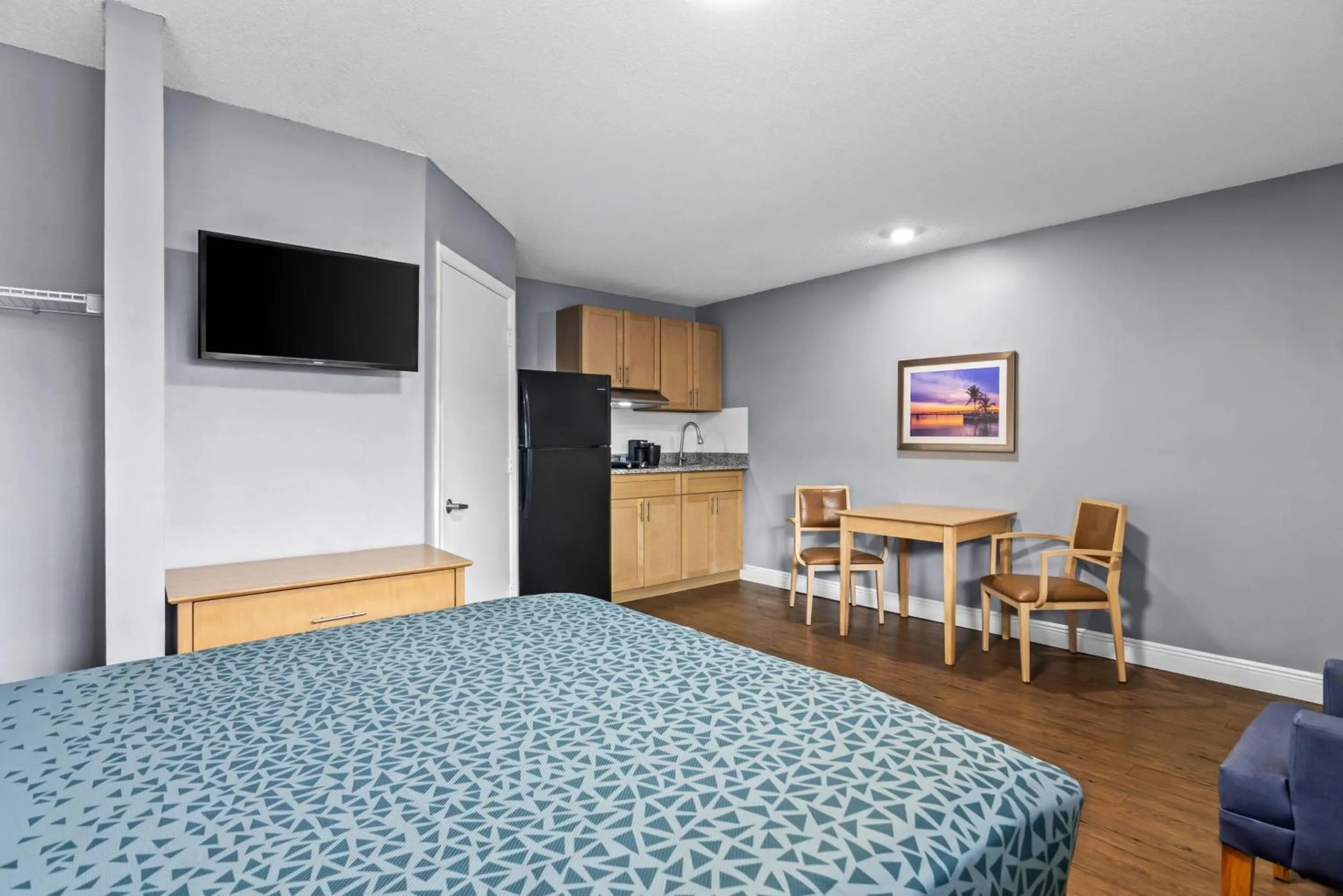 Bedroom, Bed in Suburban Studios Stuart near Federal Hwy 1