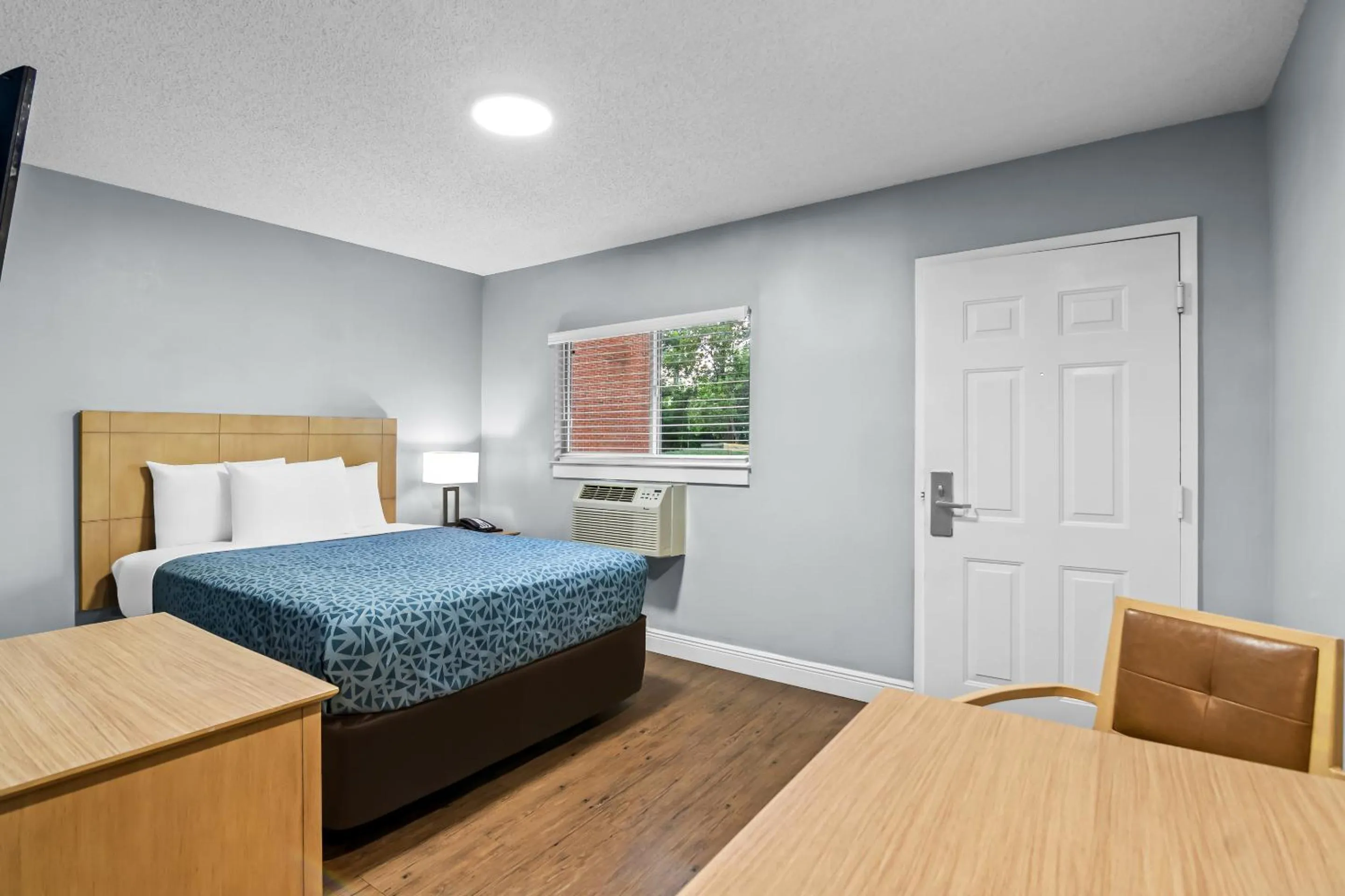 Bed in Suburban Studios Stuart near Federal Hwy 1