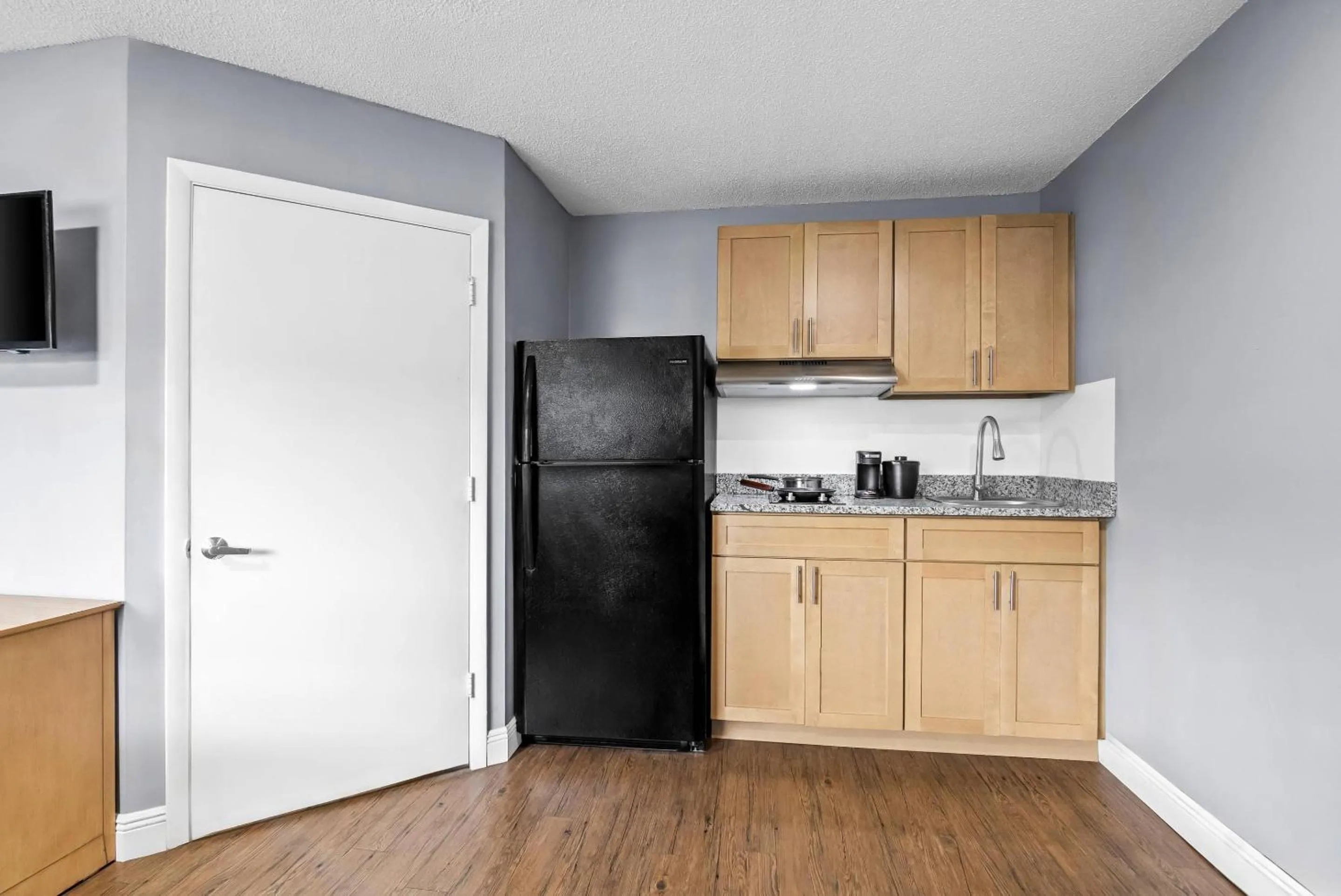 Bedroom in Suburban Studios Stuart near Federal Hwy 1