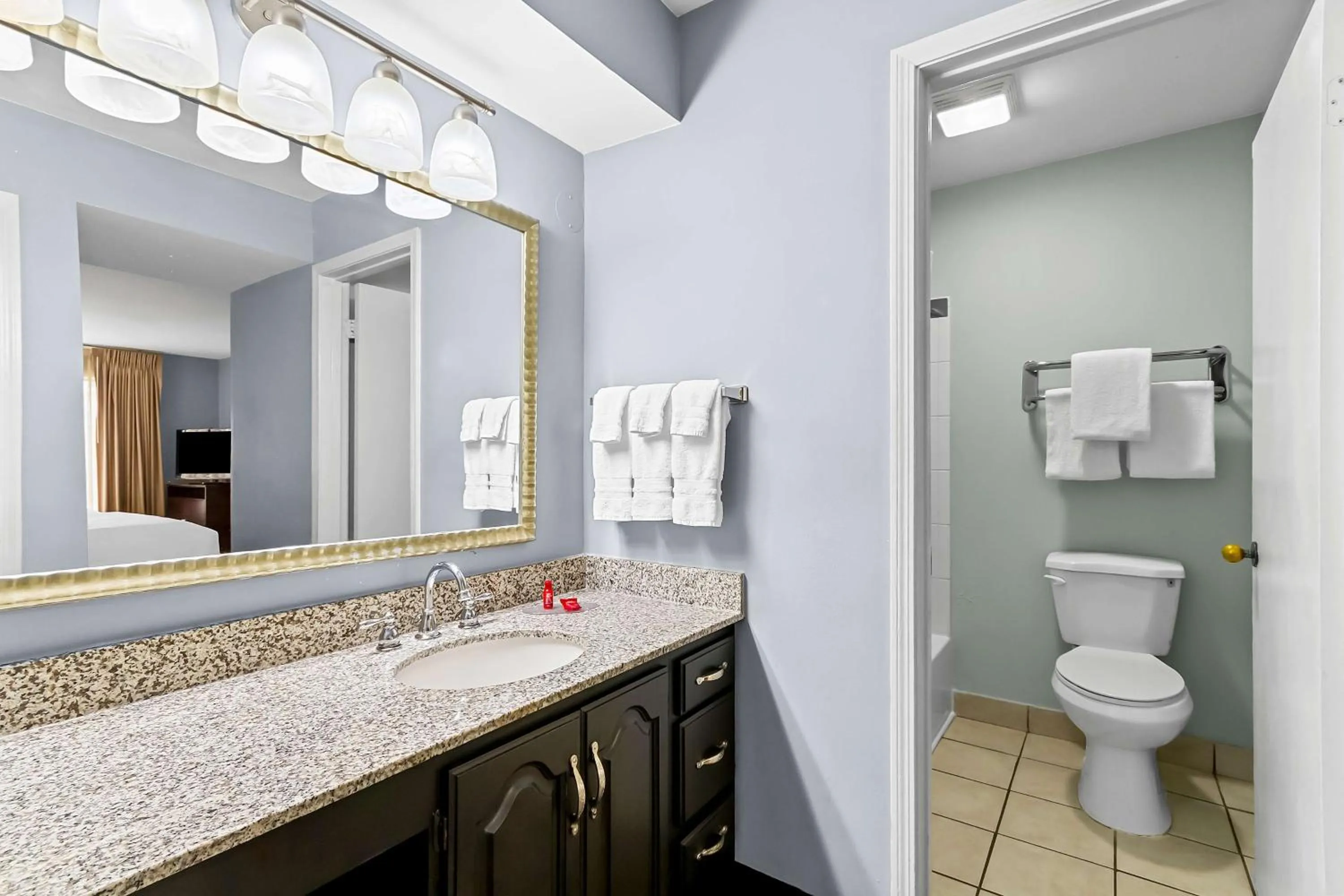 Bathroom in SureStay Studio by Best Western Pensacola