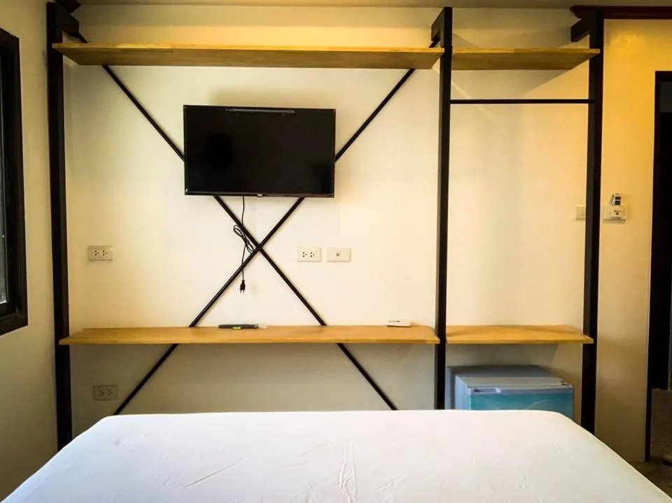 Bed in Coconut Grove Hotel Samui