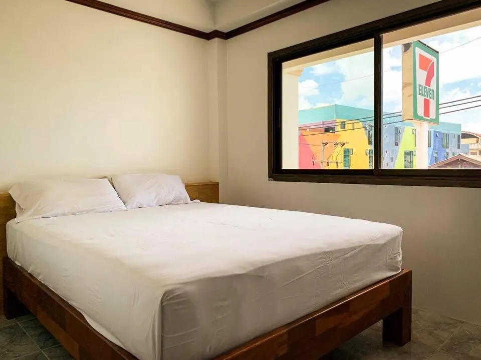 Bed in Coconut Grove Hotel Samui