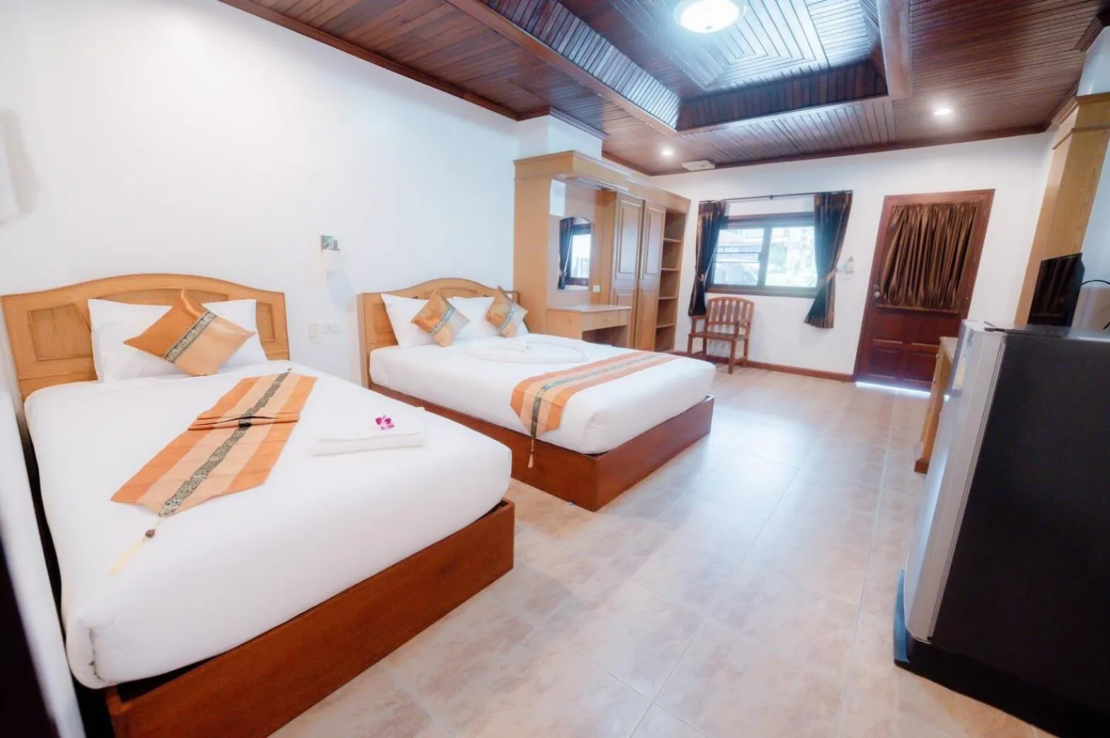 Bed in Coconut Grove Hotel Samui