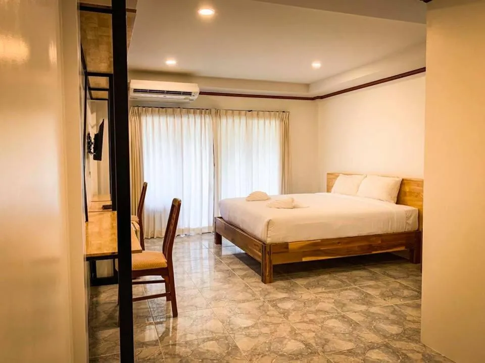 Bed in Coconut Grove Hotel Samui