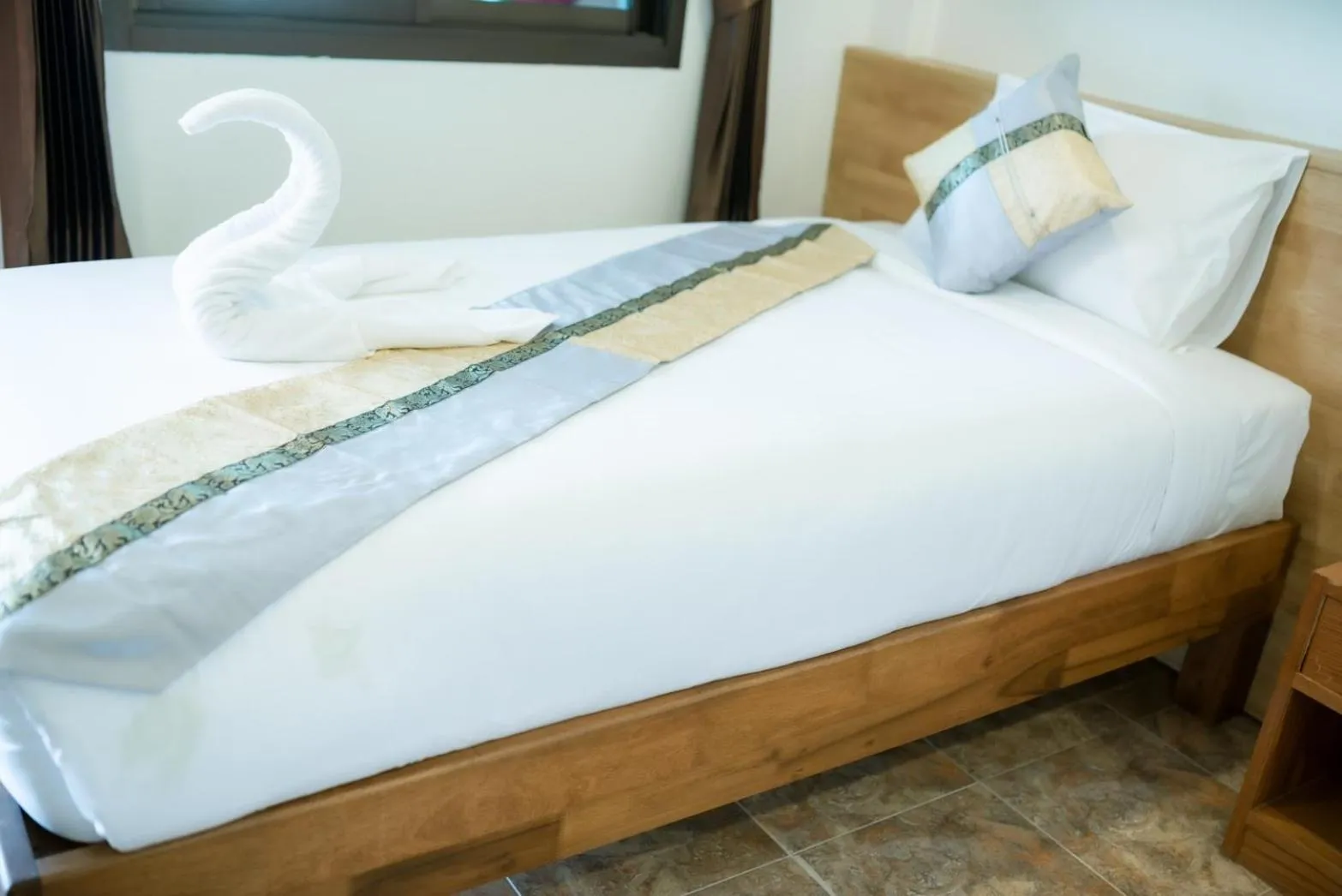 Bed in Coconut Grove Hotel Samui