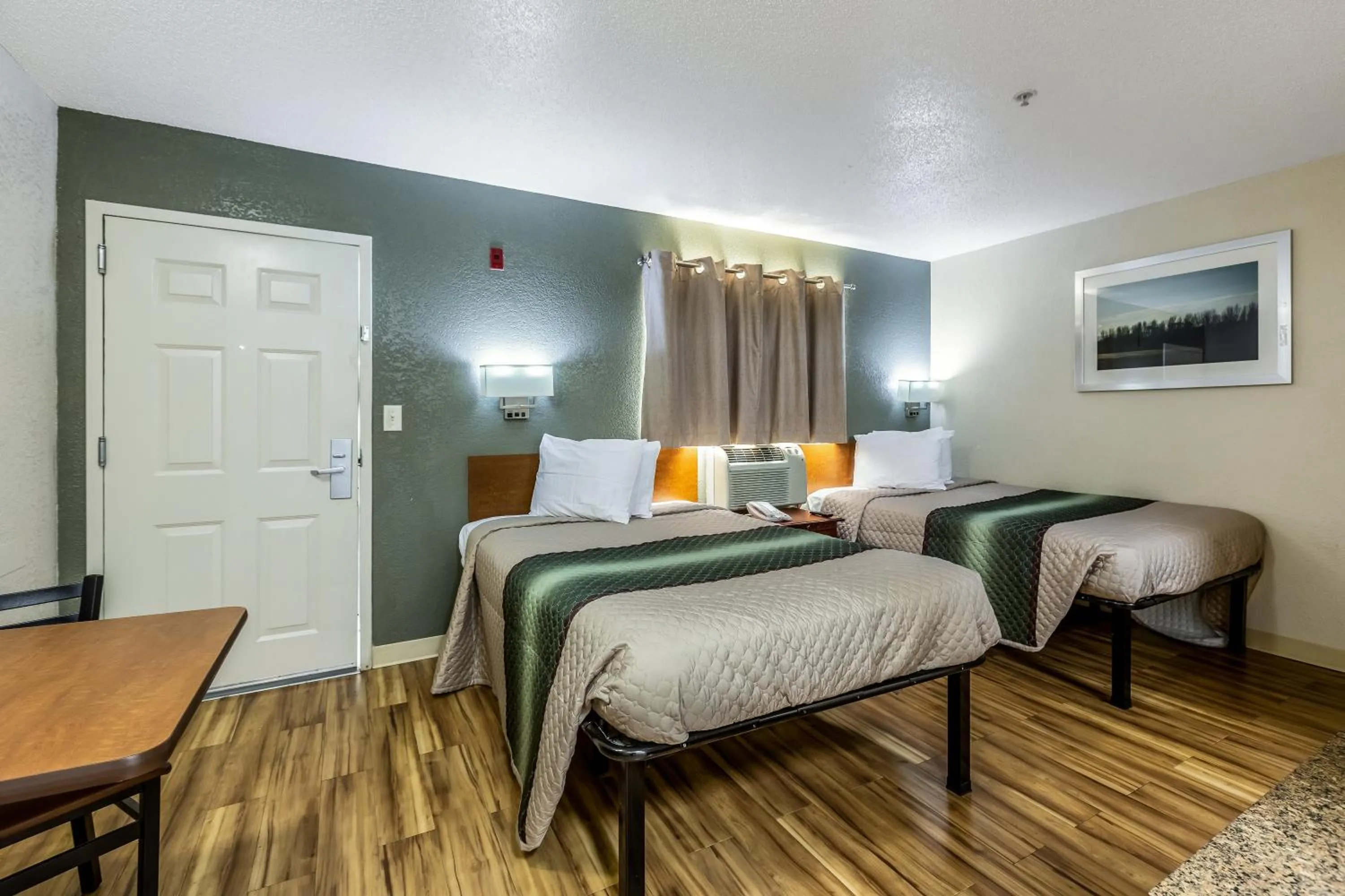 Photo of the whole room, Bed in HomeTowne Studios by Red Roof Atlanta - Chamblee