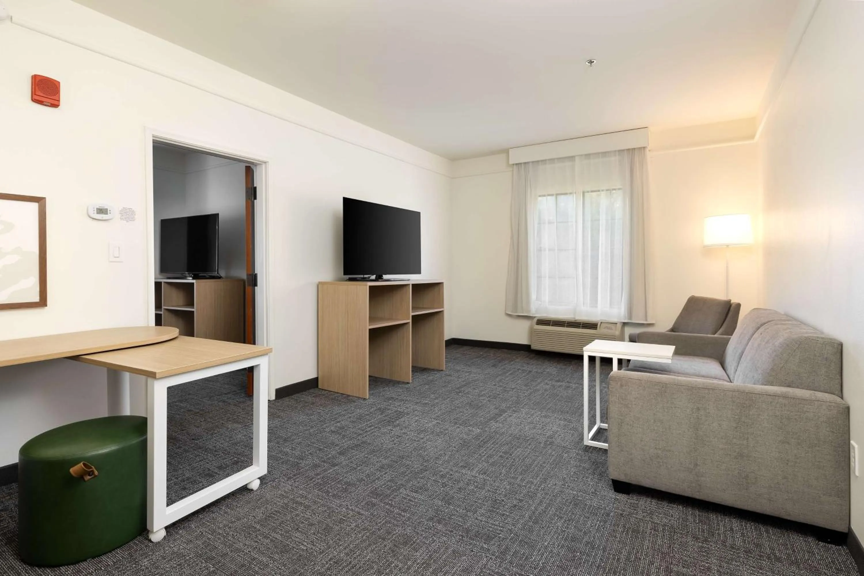 Living room in Spark by Hilton Savannah Airport