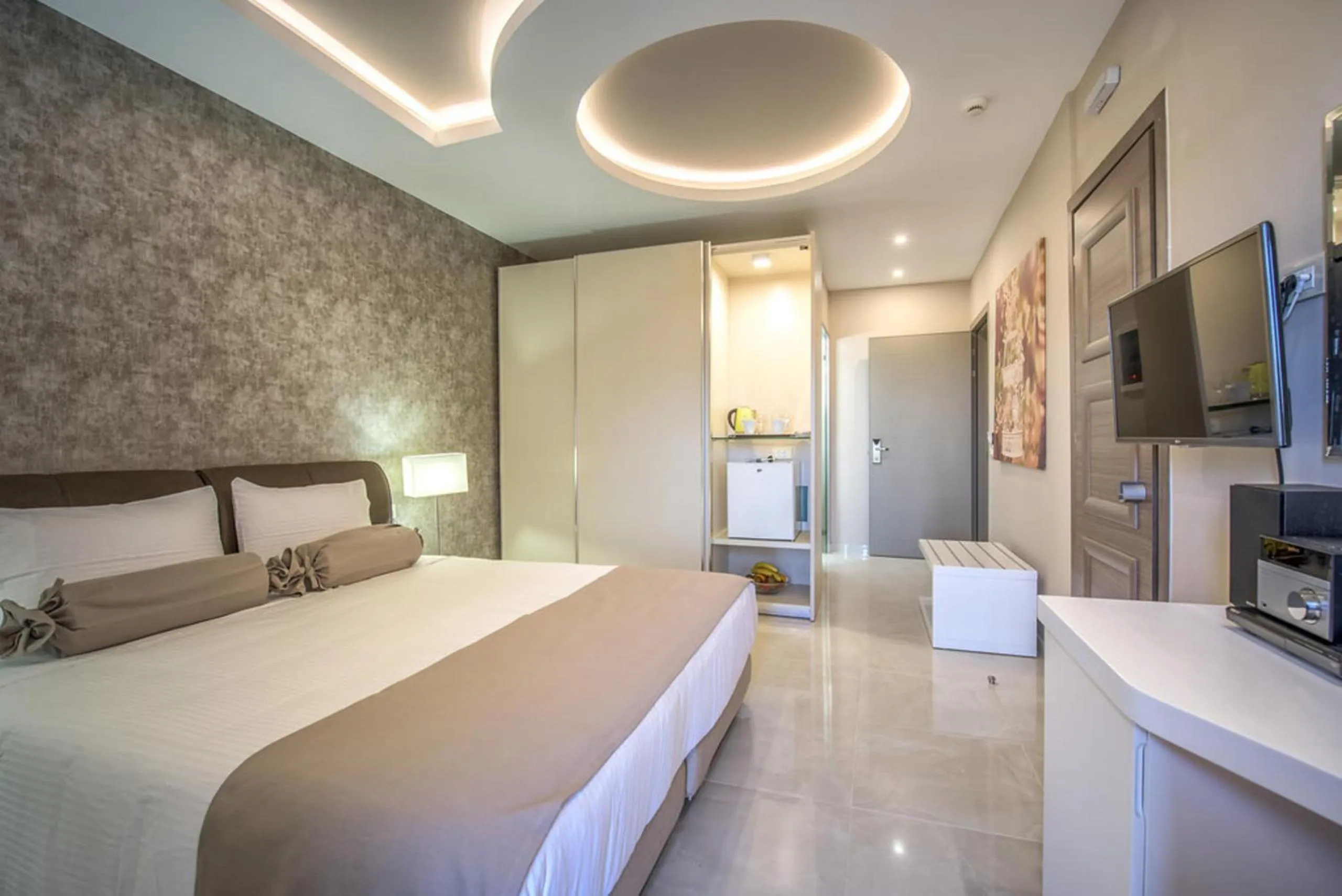 Photo of the whole room, Bed in Koukounaria Hotel & Suites