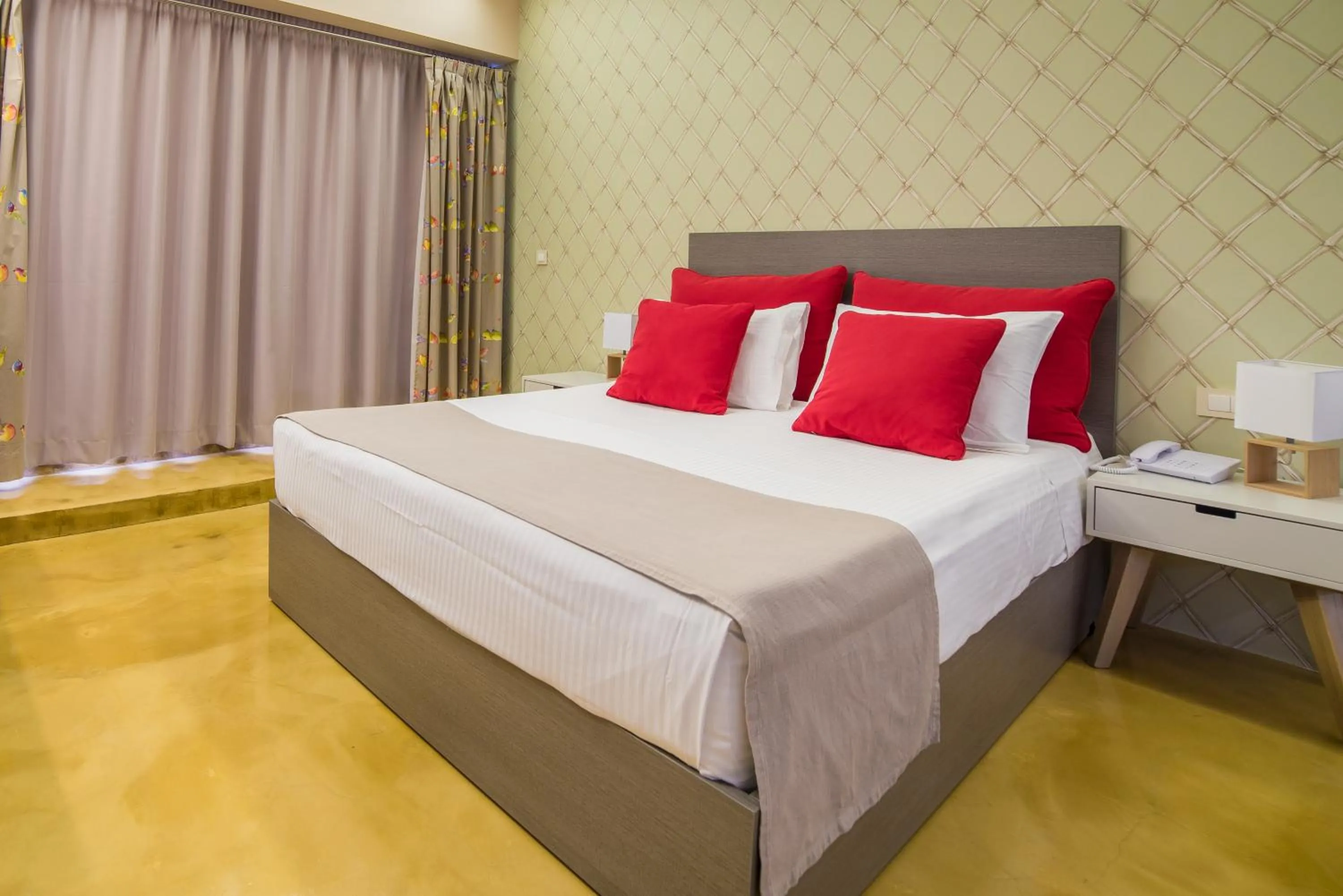 Bed in Koukounaria Hotel & Suites