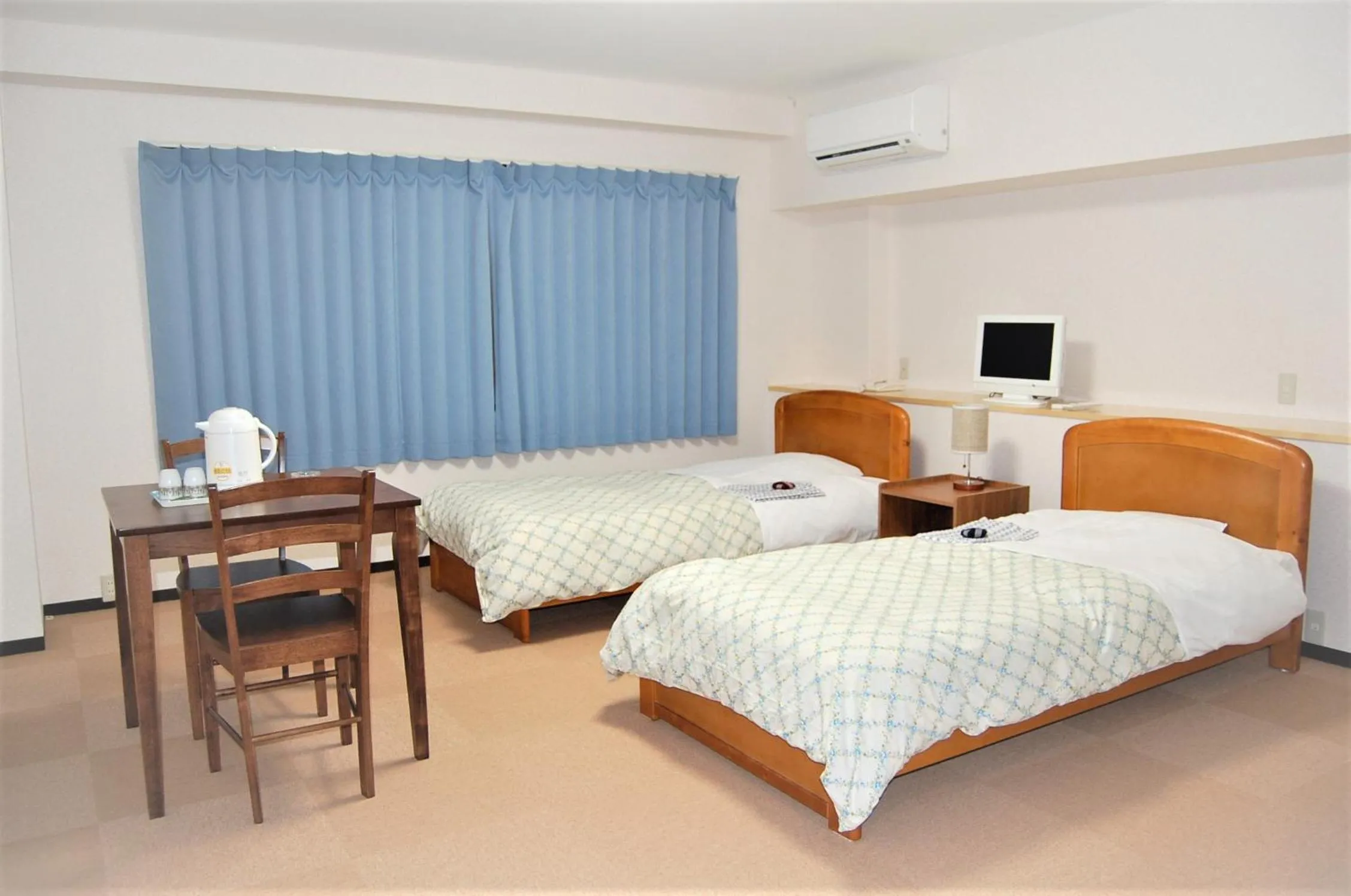 Bed in Ito Station Hotel