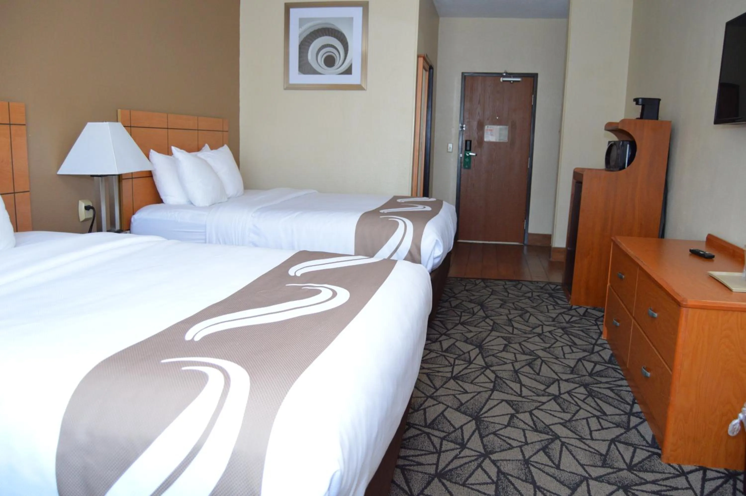 Photo of the whole room, Bed in Quality Inn Coralville - Iowa River Landing