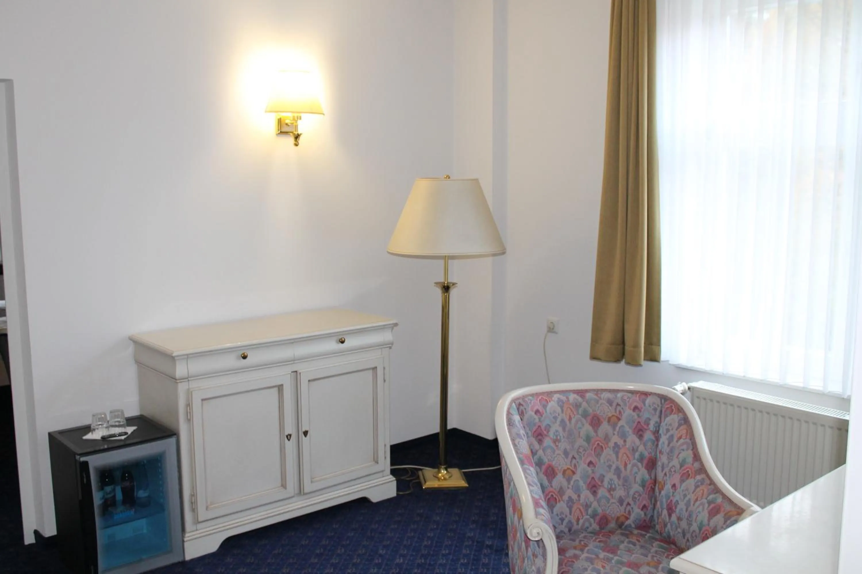 Communal lounge/ TV room, Bed in Fürstenhof Wernigerode Garni