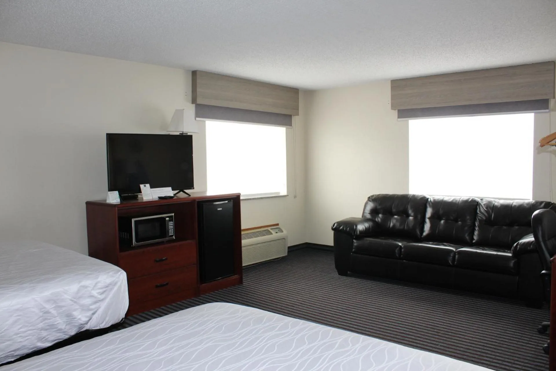 Bed in Reston Inn & Suites