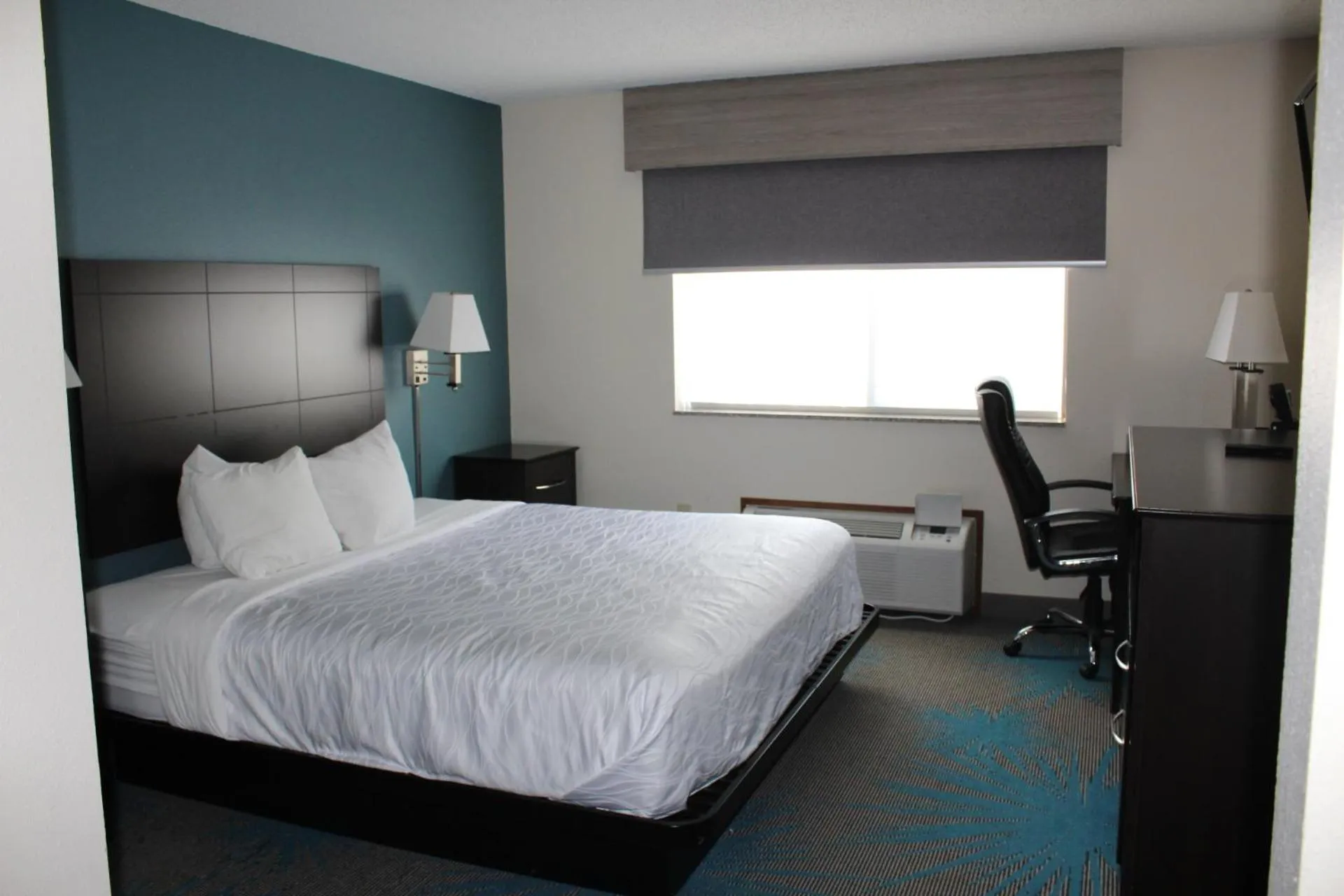Bed in Reston Inn & Suites