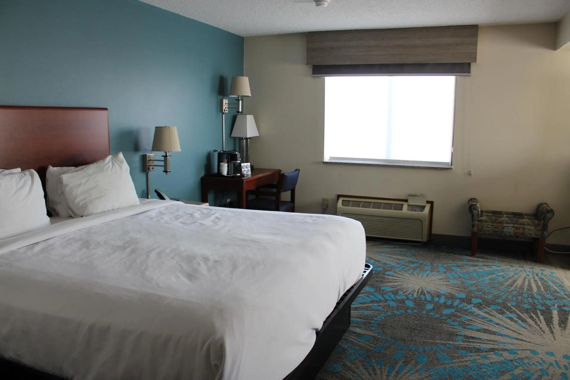 Bed in Reston Inn & Suites